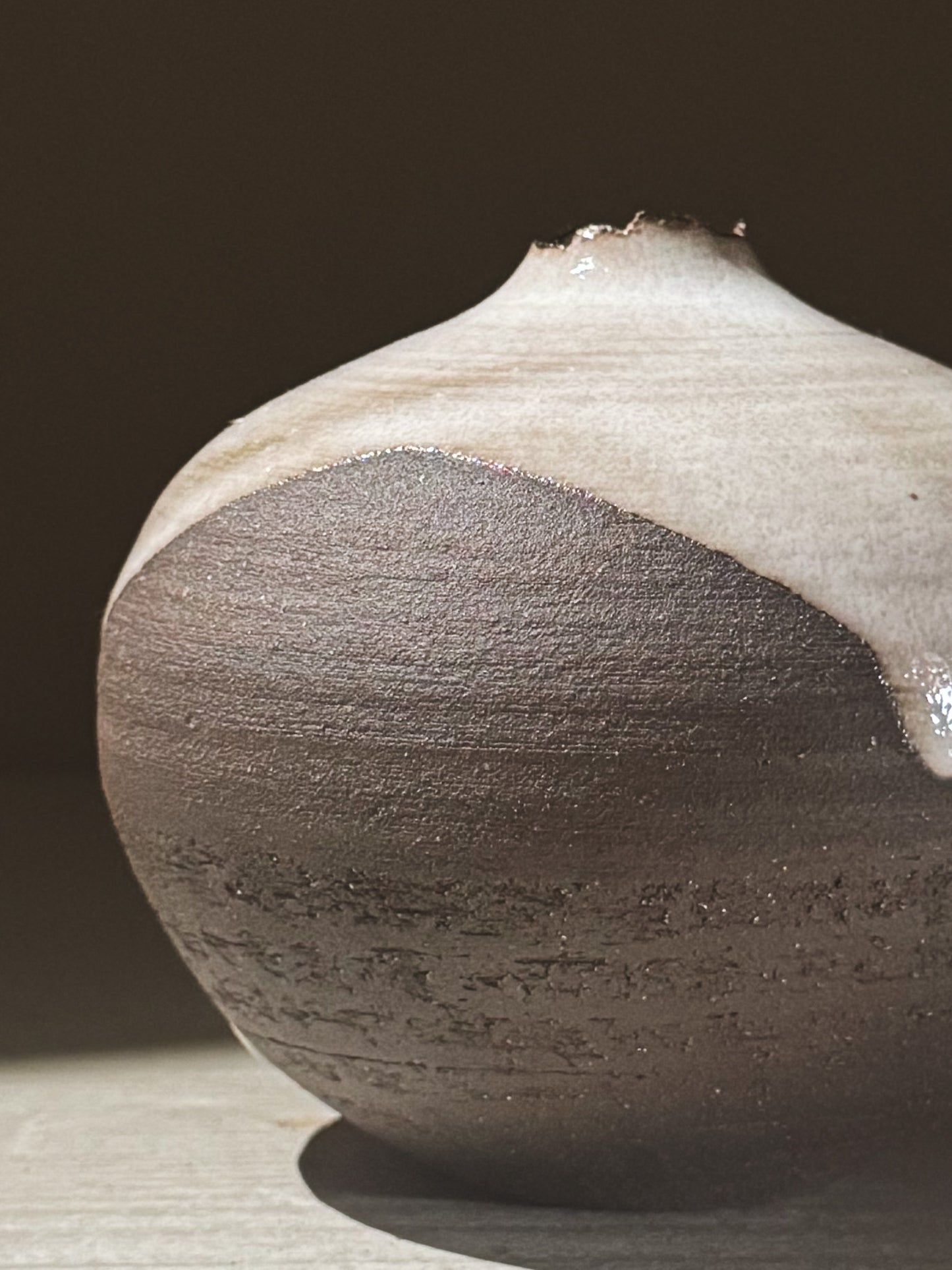 Orb Vase – Yuki Black #08 showcasing unique glaze movement and organic patterns in a rounded design.