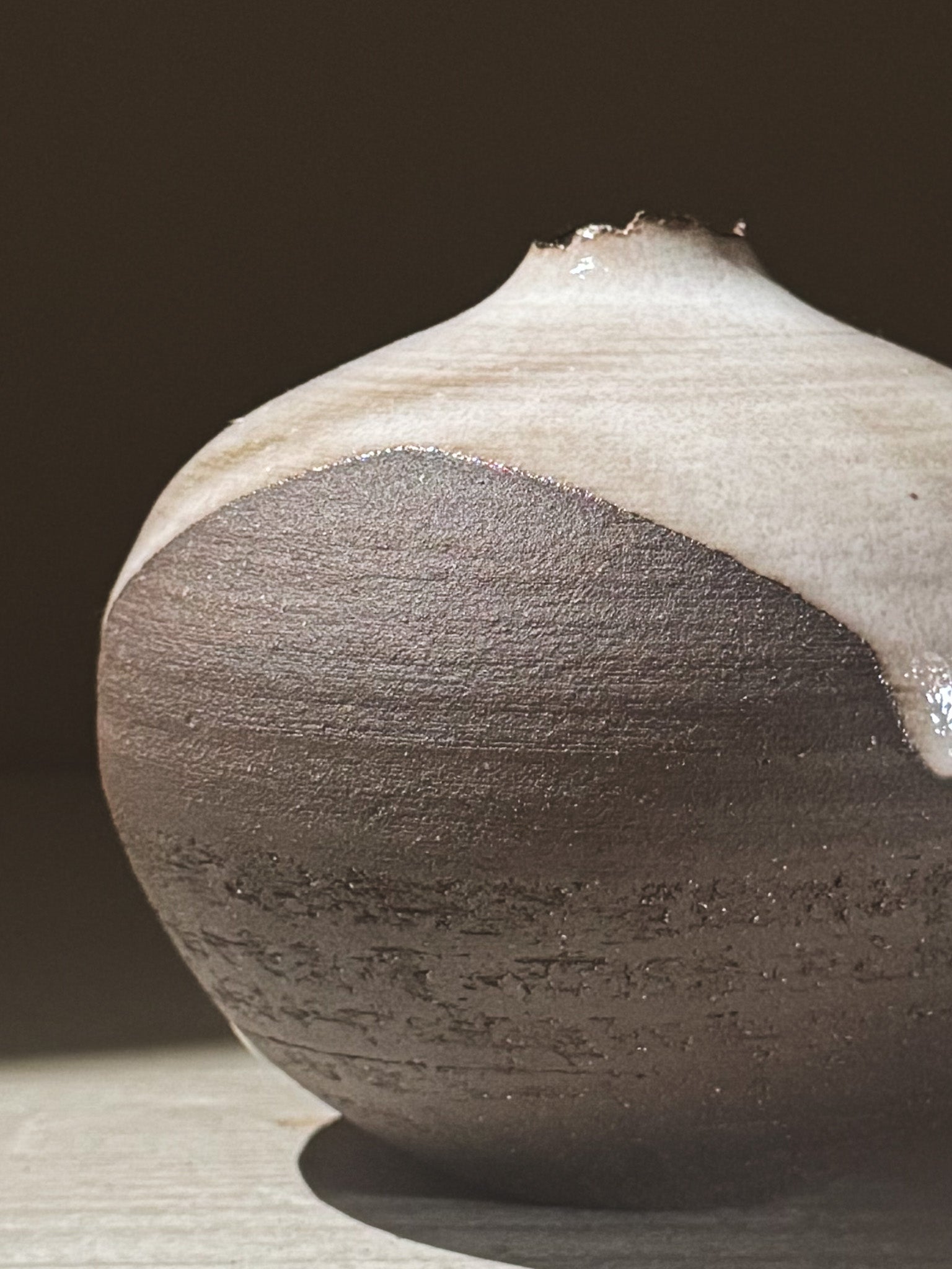 Orb Vase – Yuki Black #08 showcasing unique glaze movement and organic patterns in a rounded design.