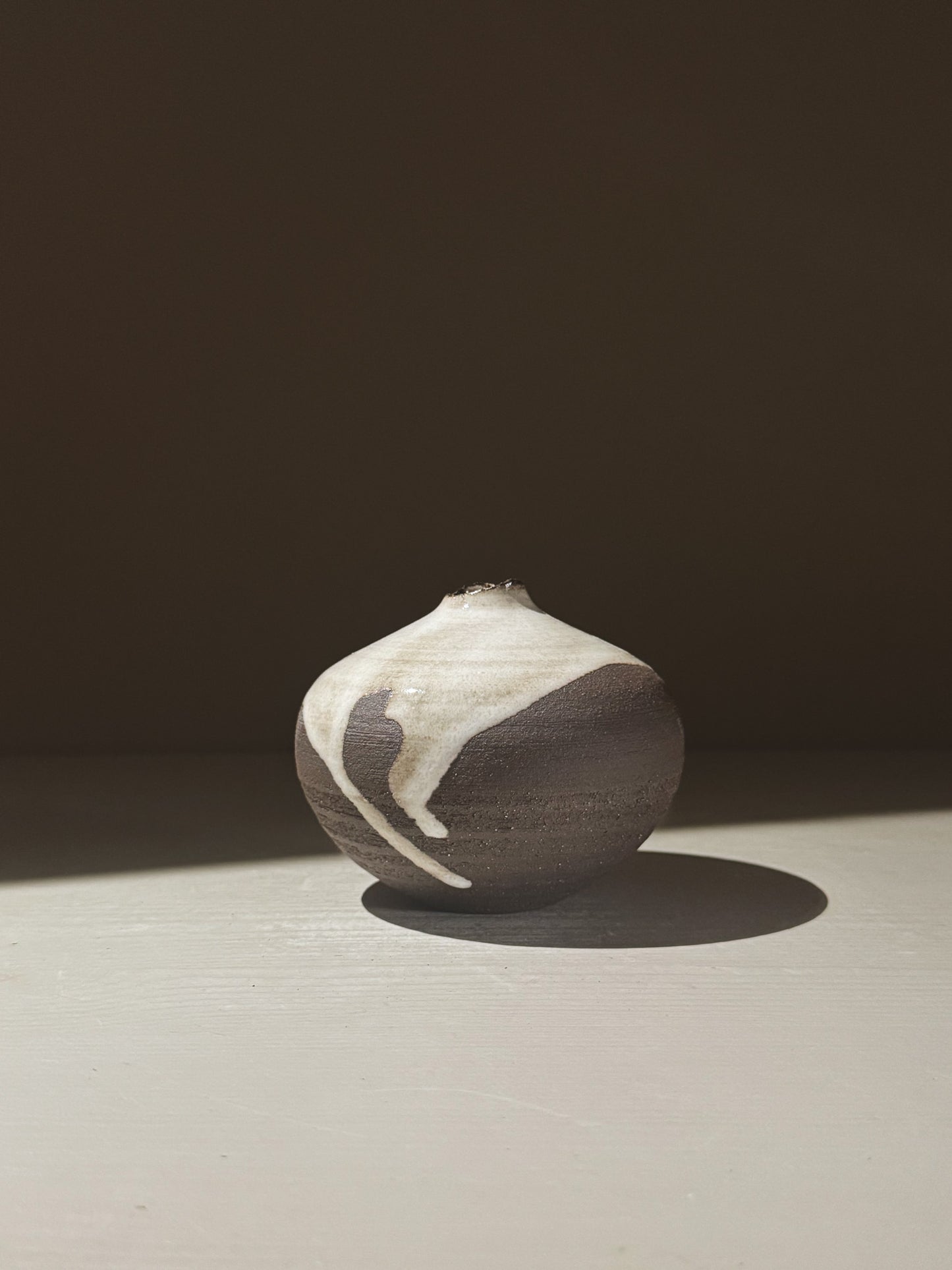 Orb Vase – Yuki Black #09 showcasing unique glaze patterns and rounded design, perfect for home decor.