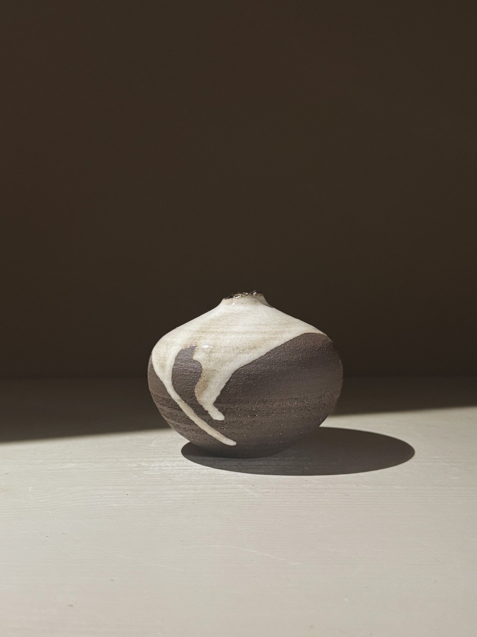 Orb Vase – Yuki Black #09 showcasing unique glaze patterns and rounded design, perfect for home decor.