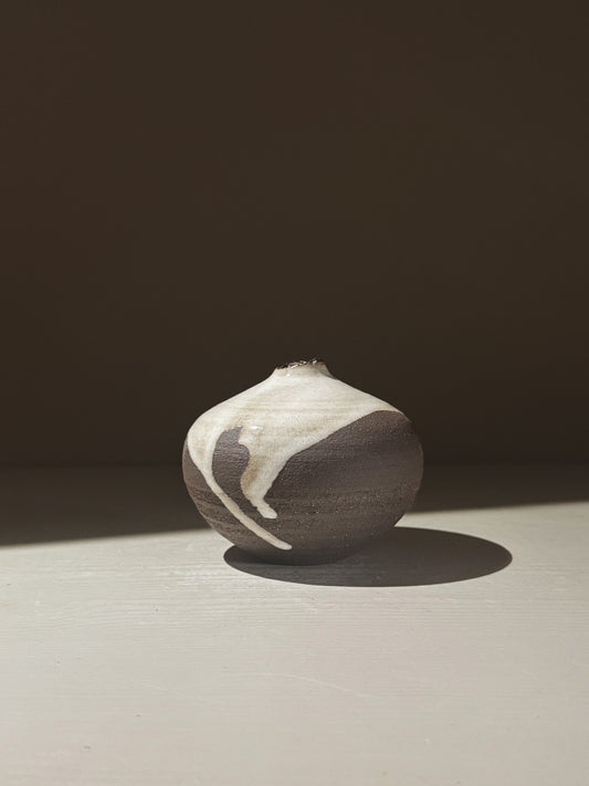 Orb Vase – Yuki Black #09 showcasing unique glaze patterns and rounded design, perfect for home decor.