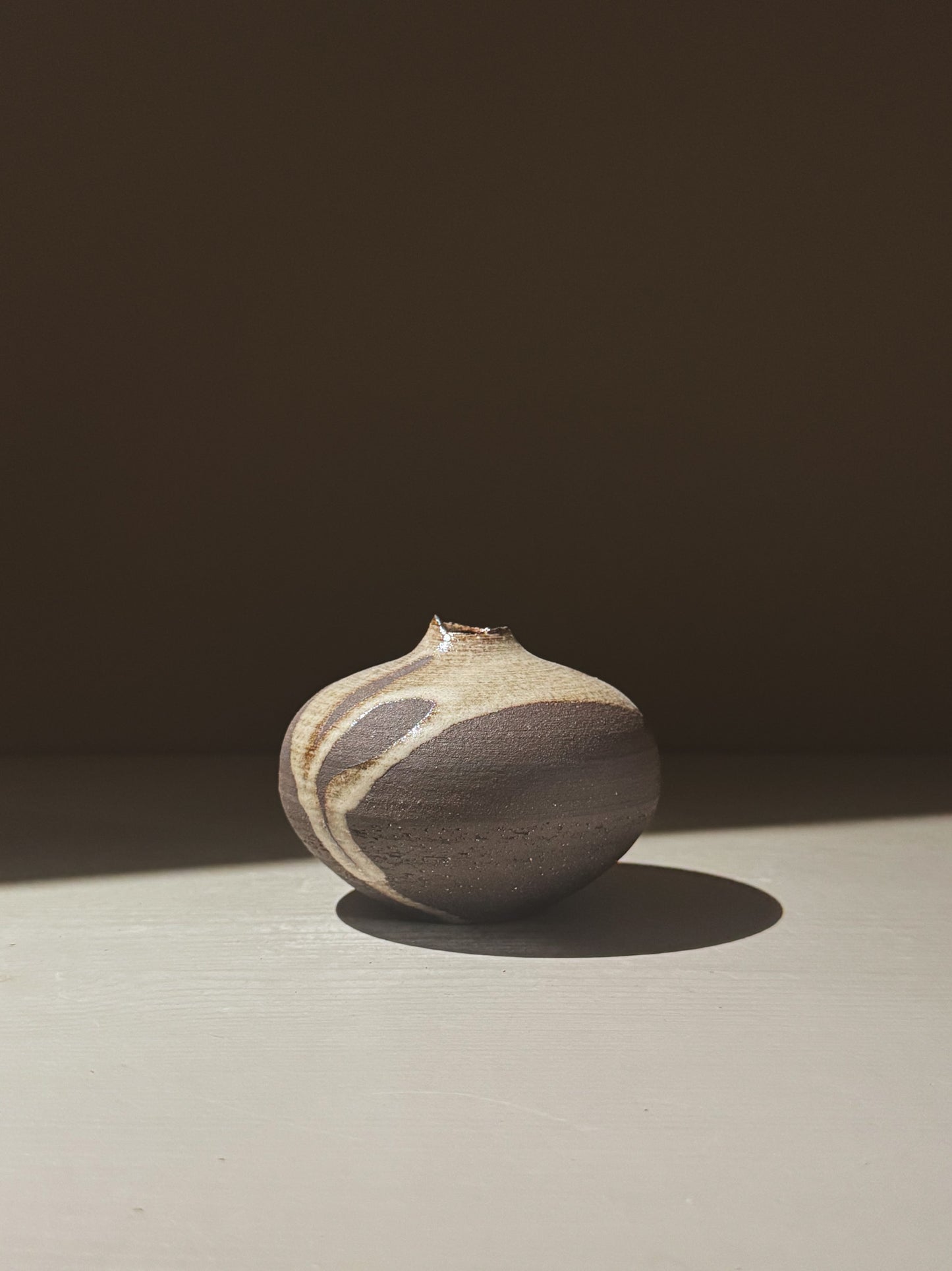Orb Vase – Yuki Black #10, unique clay vase with organic patterns and gentle glaze movement.