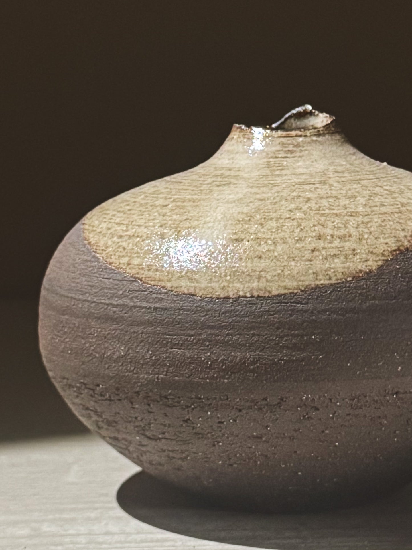 Orb Vase – Yuki Black #10 showcasing unique clay and glaze patterns with a calm, sculptural presence.