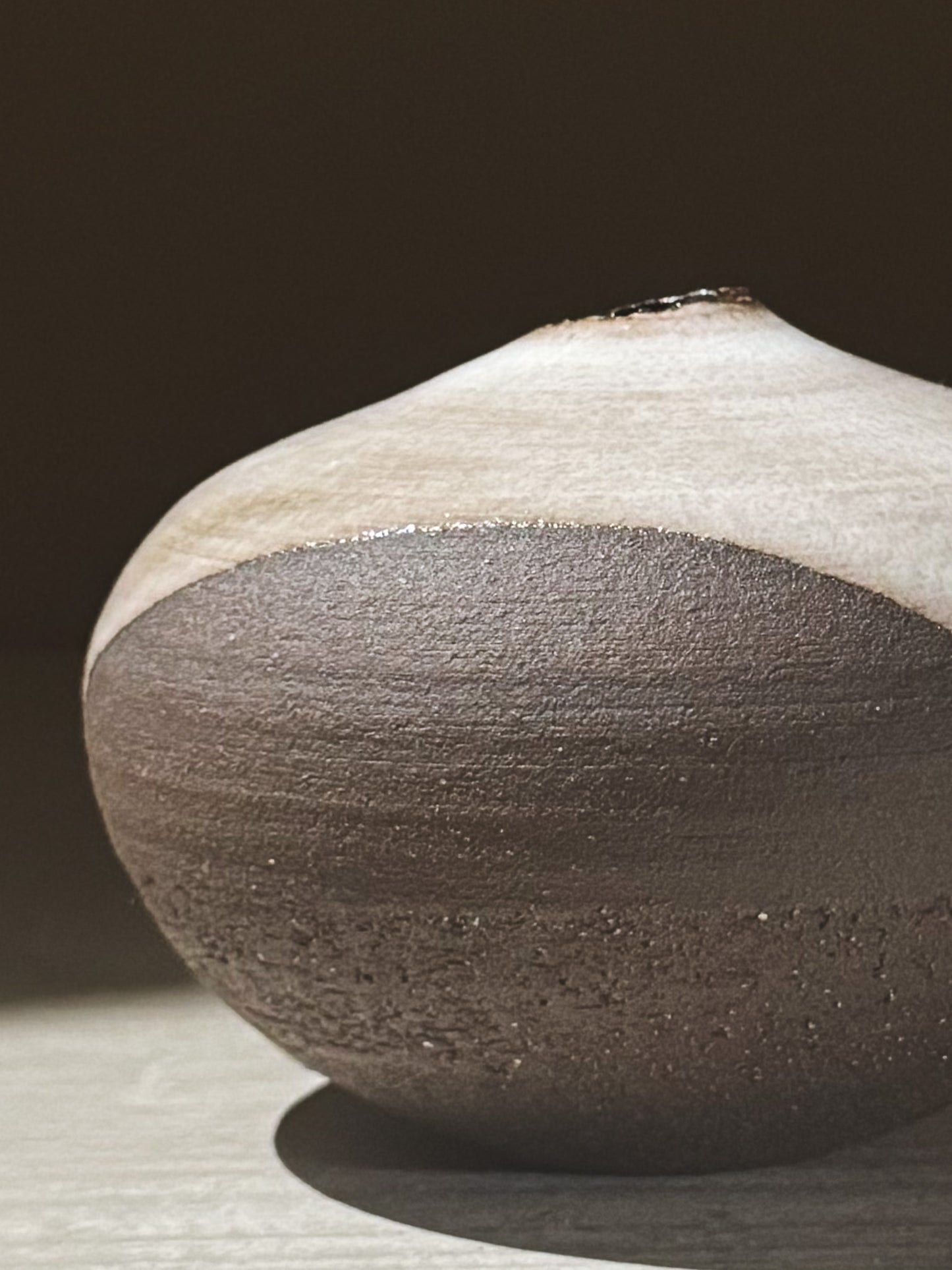 Orb Vase – Yuki Black #12 showcasing its unique glaze movement and calm, sculptural presence.