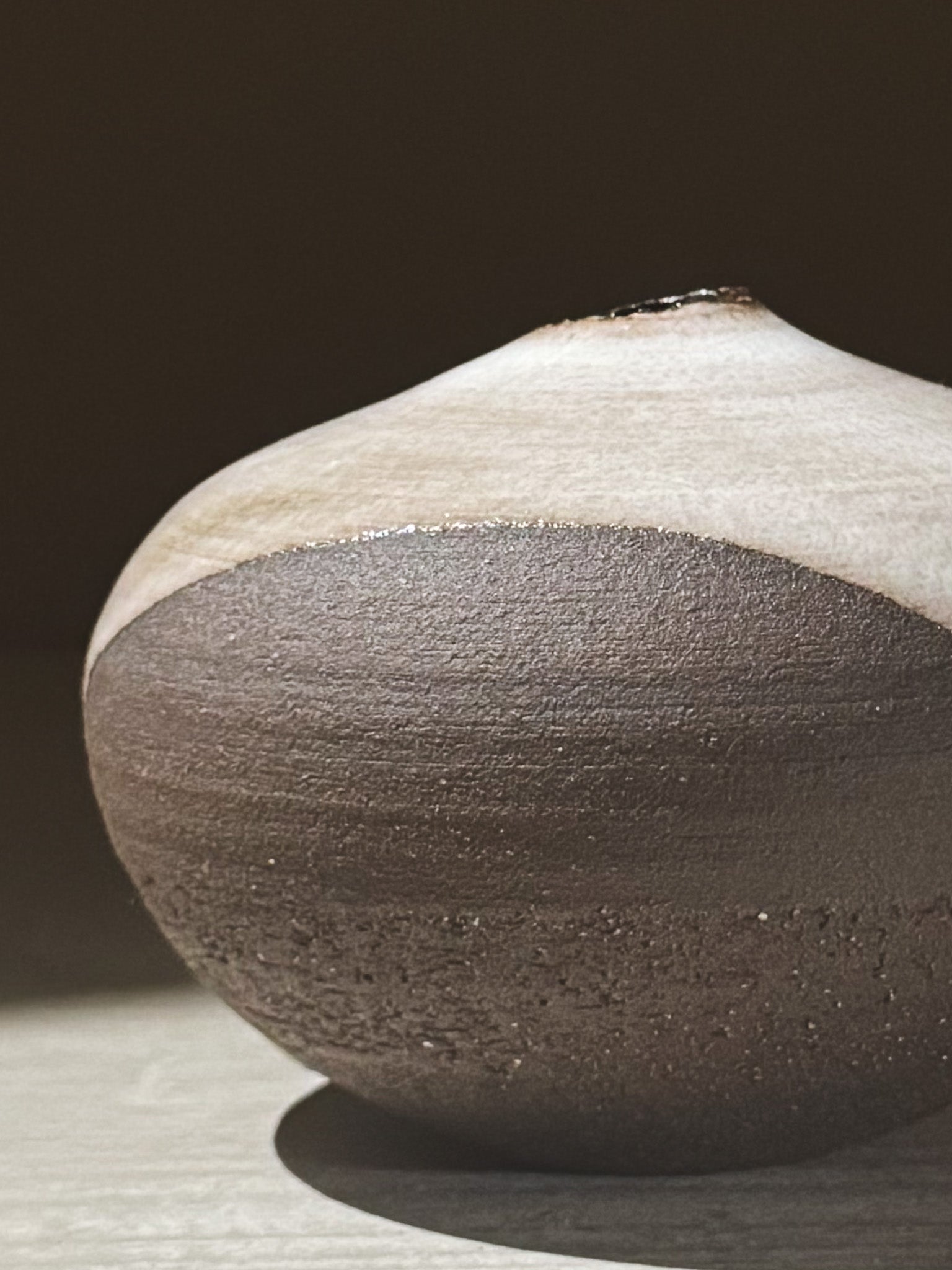 Orb Vase – Yuki Black #12 showcasing its unique glaze movement and calm, sculptural presence.