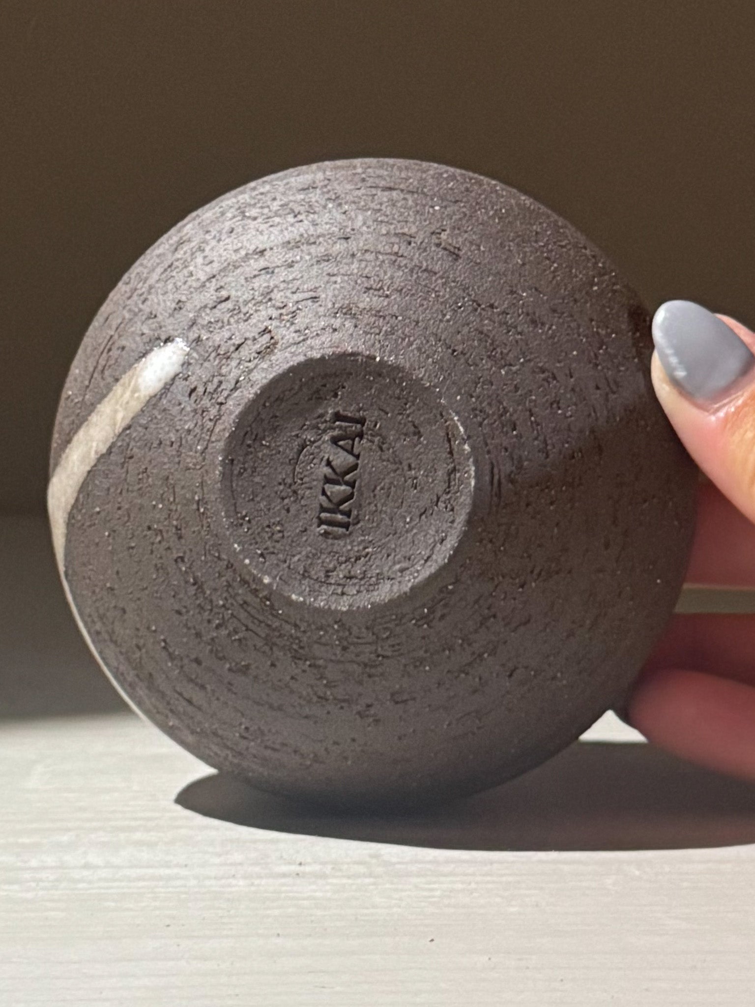 Orb Vase – Yuki Black #13 showing the bottom view with organic texture and unique glaze patterns.