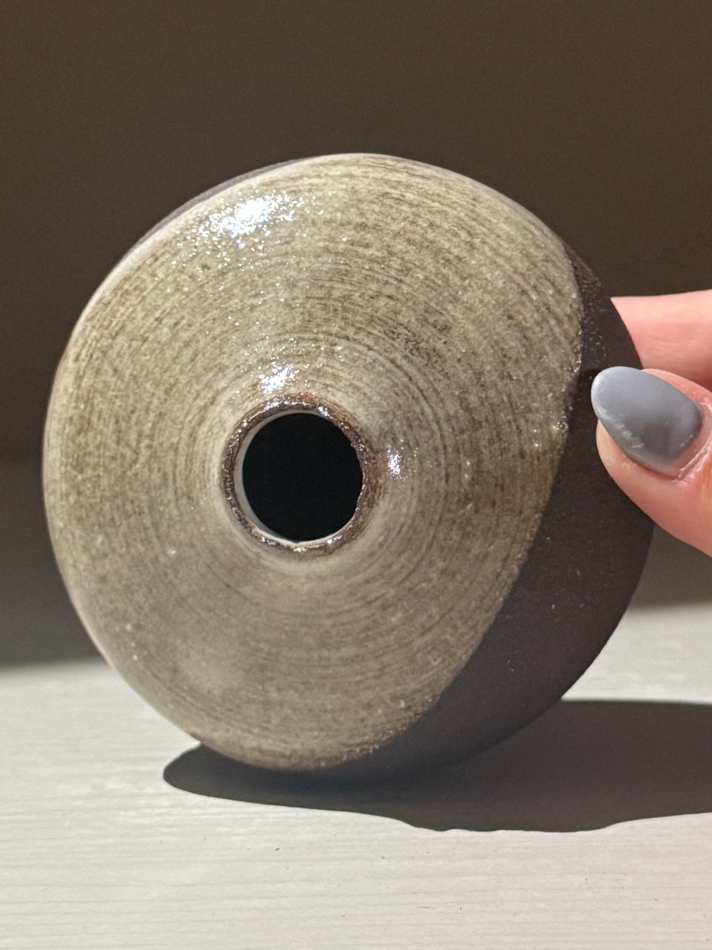 Orb Vase – Yuki Black #14, unique rounded vessel with organic glaze patterns and soft spherical form.