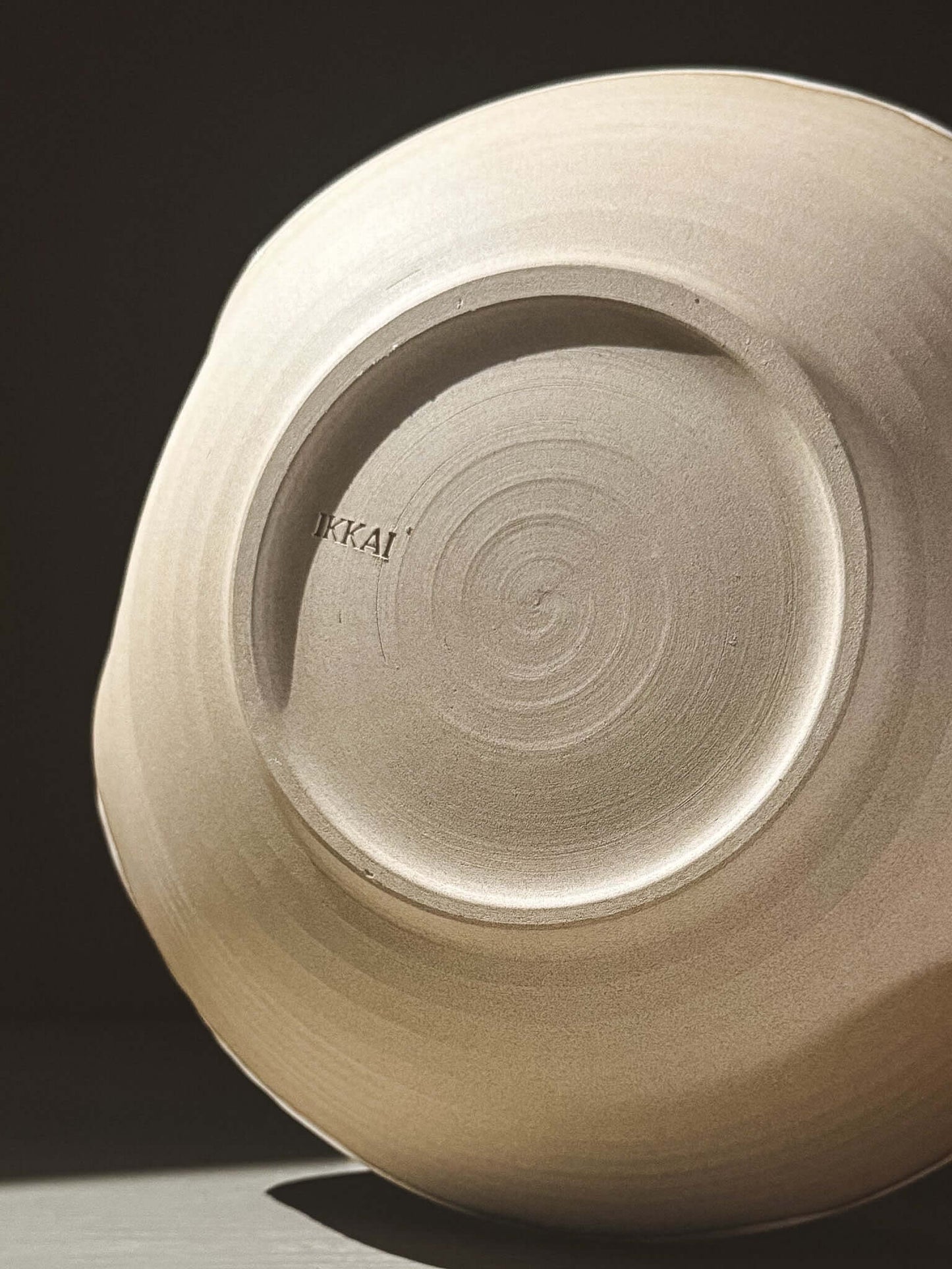 Bottom view of Salad/Pasta Plate – Yuki showcasing its unique handcrafted design and smooth finish.