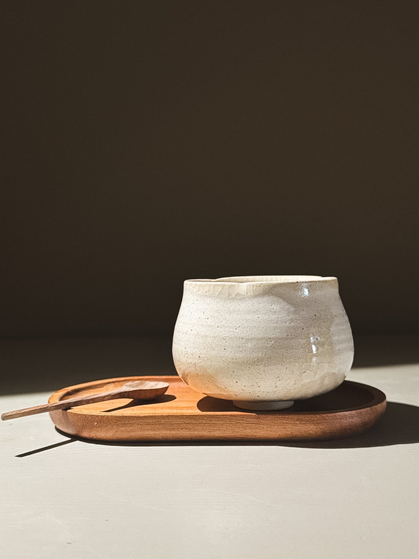 Yunomi Cup - Kannyū Series  #11 on a wooden tray with a spoon, showcasing its elegant design and crackle glaze.