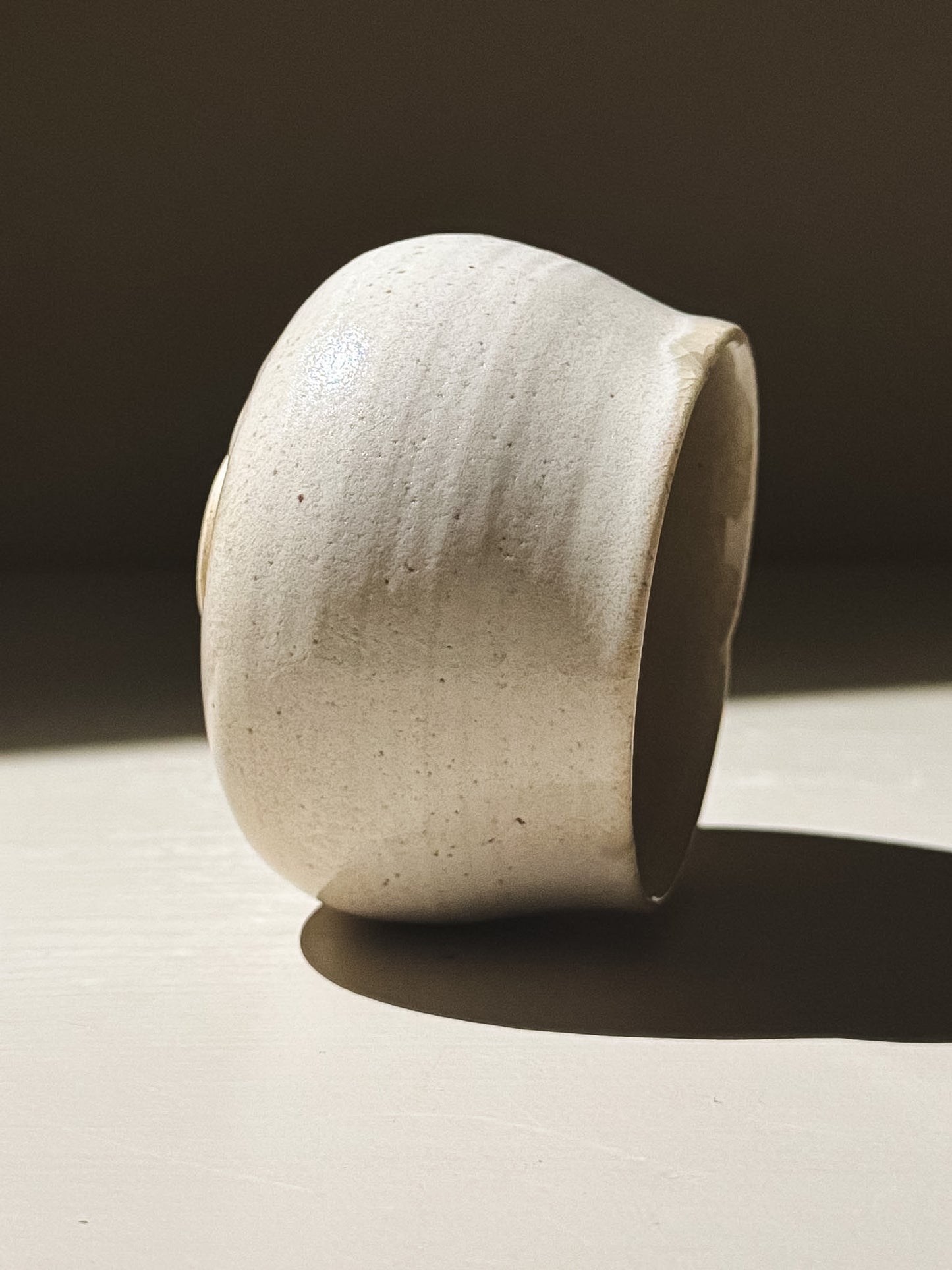 Yunomi Cup - Kannyū Series  #11 side view displaying the elegant crackle glaze and softly flowing rim.