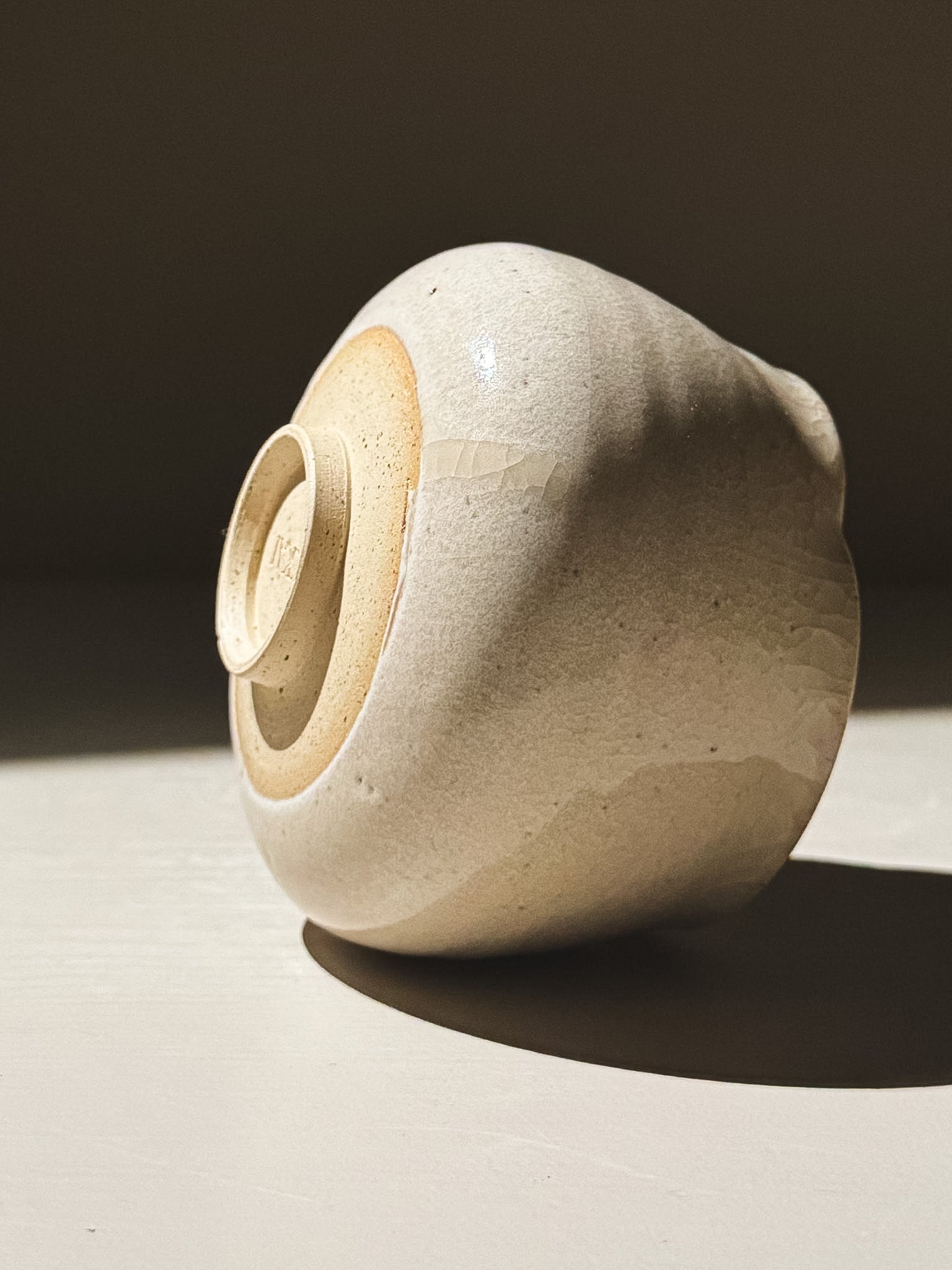 Yunomi Cup - Kannyū Series  #12 with delicate crackle glaze and softly flowing rim on display.