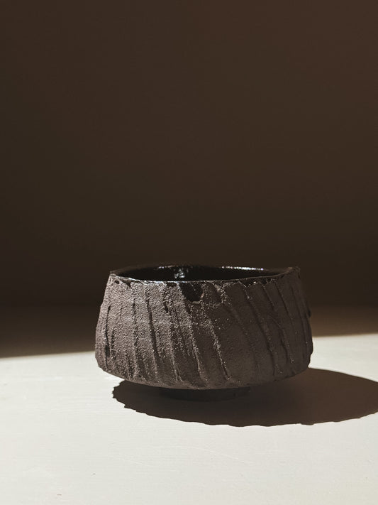 Kuro Matcha Bowl #03 with rough textured dark brown exterior and glossy dark interior, inspired by volcanic stone.