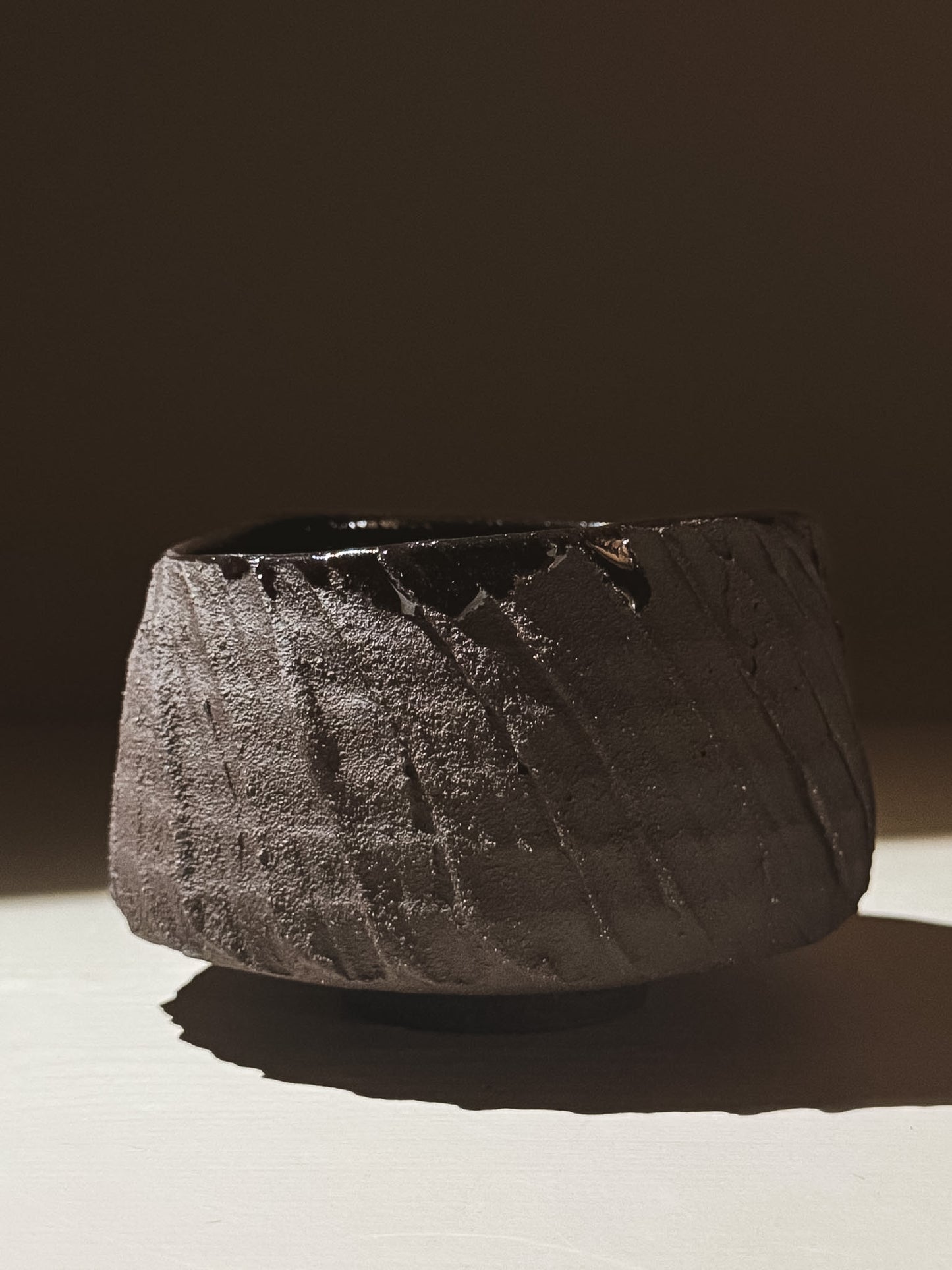Kuro Matcha Bowl #05 featuring textured dark brown slip and glossy dark glaze.