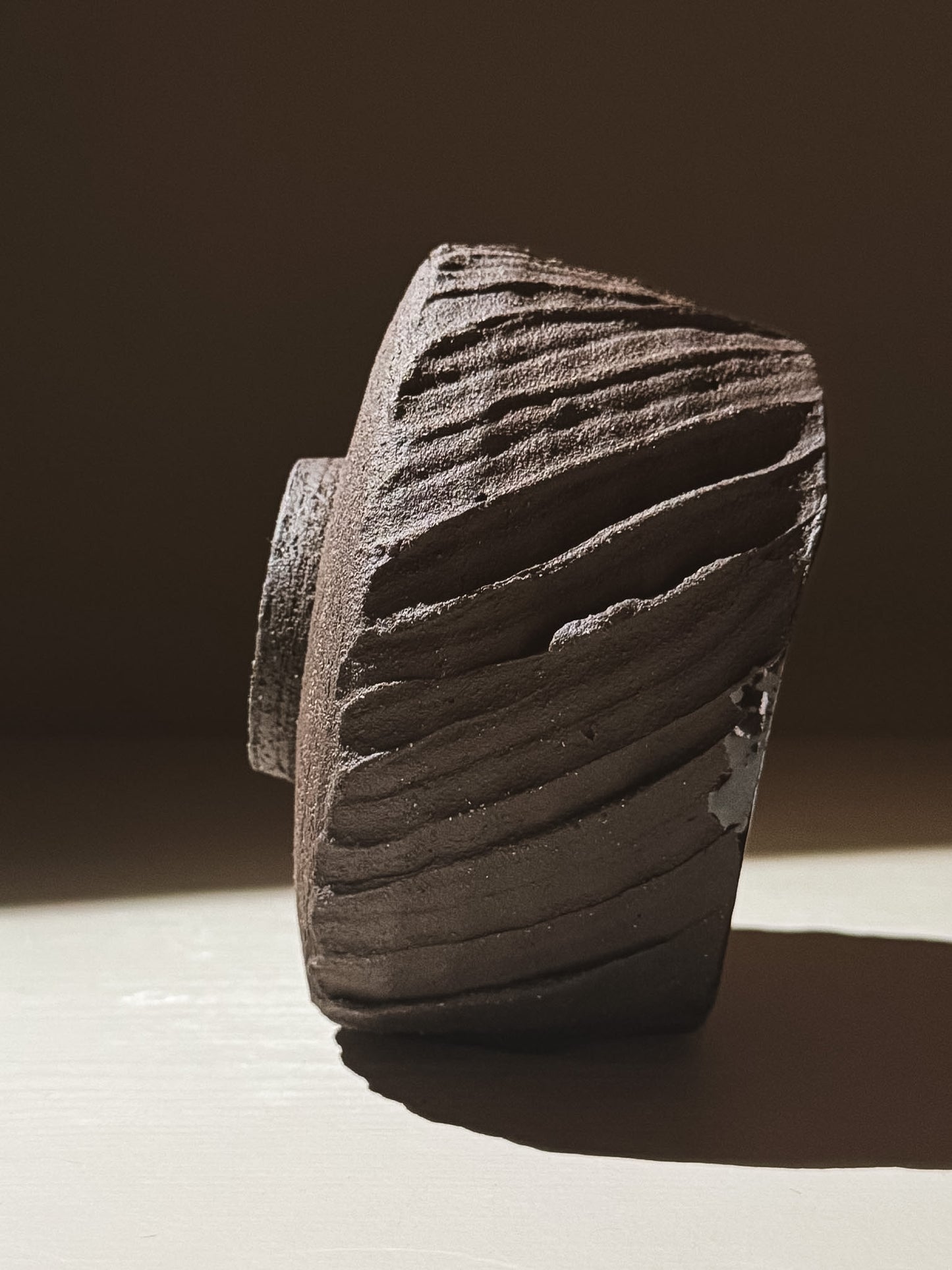Kuro Matcha Bowl #05 showcasing textured dark brown slip and striking earthy design elements.