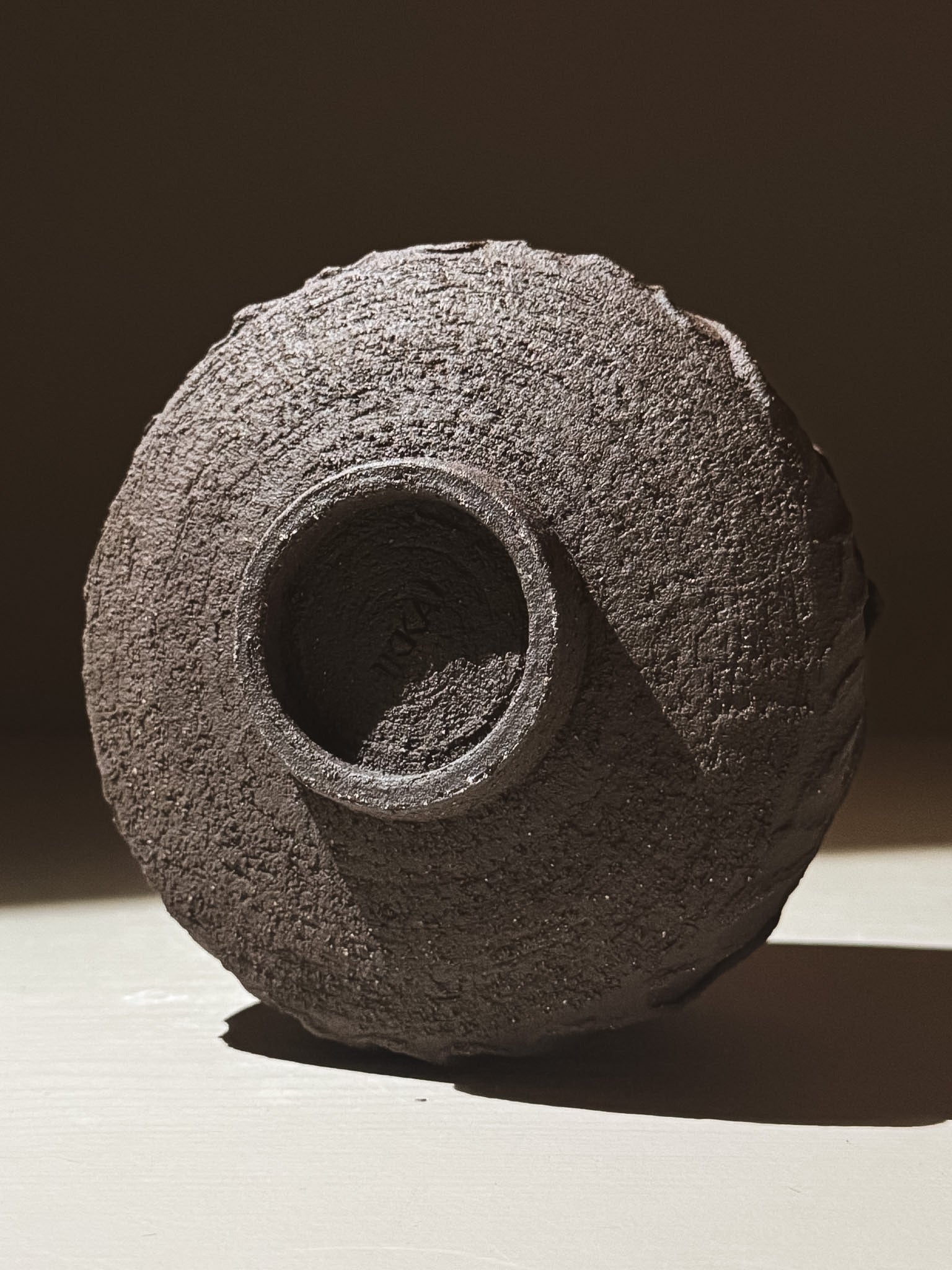 Kuro Matcha Bowl #05 showcasing a textured dark brown exterior with volcanic stone inspiration.