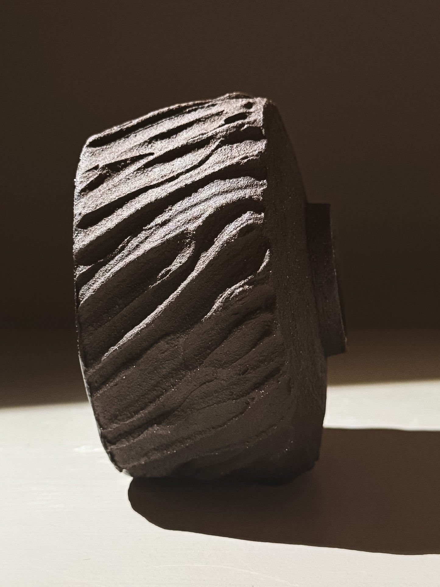 Kuro Matcha Bowl #06 with textured dark brown slip designed to resemble volcanic stone.