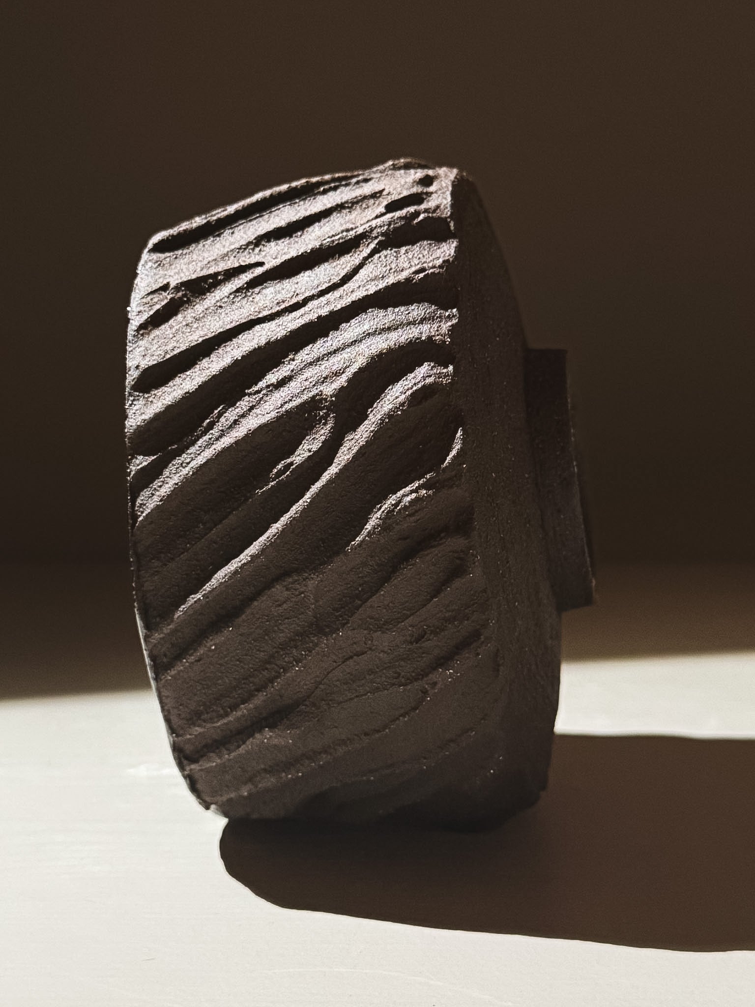 Kuro Matcha Bowl #06 with textured dark brown slip designed to resemble volcanic stone.