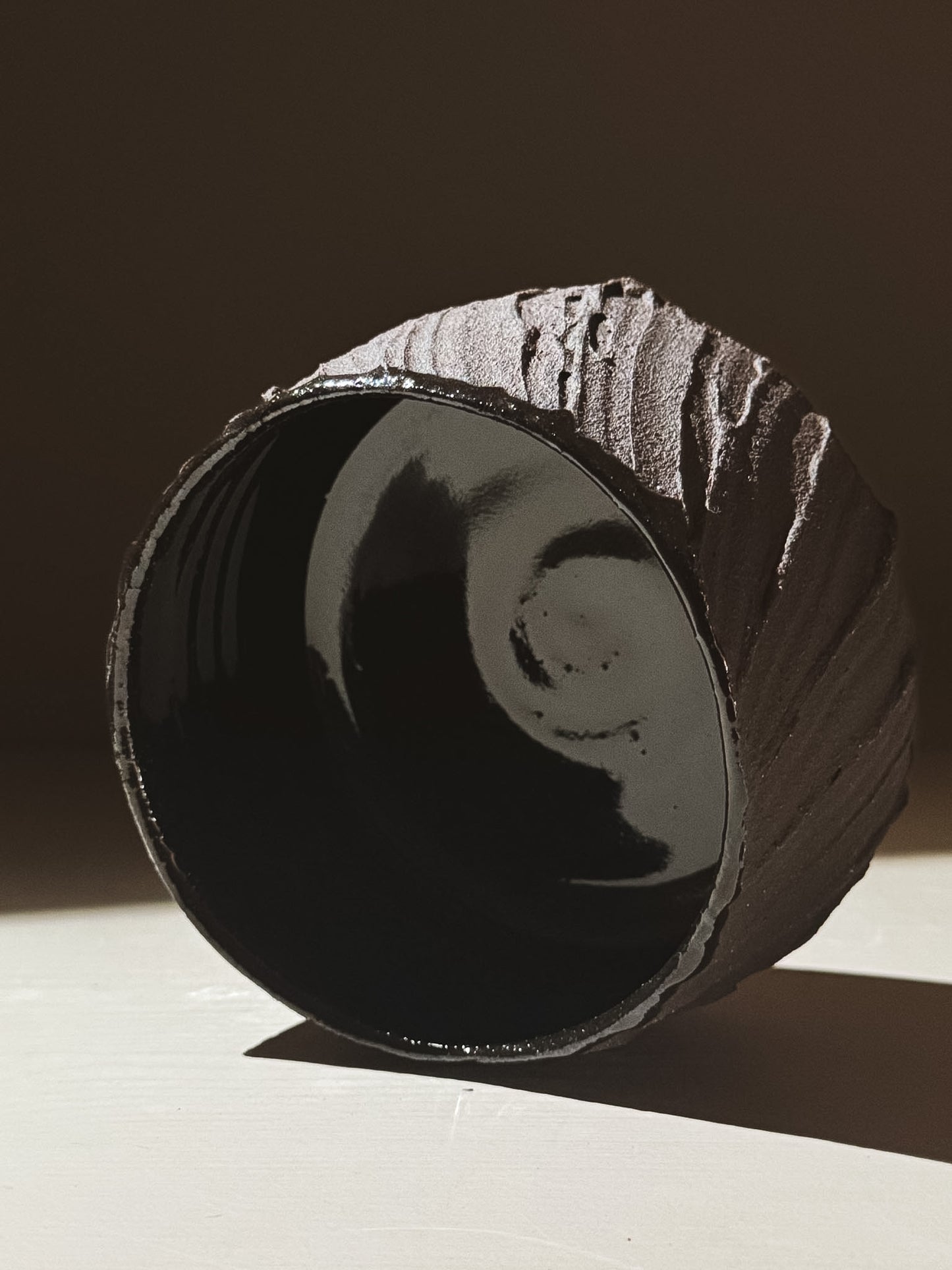 Kuro Matcha Bowl #07 featuring a textured dark brown exterior and glossy black interior.
