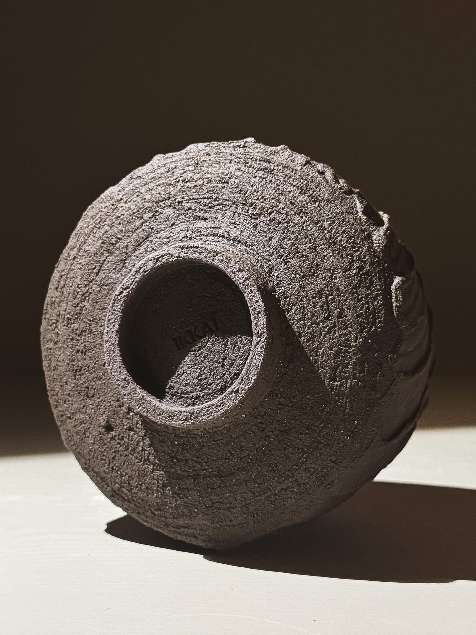 Kuro Matcha Bowl #07 with textured dark brown slip finish, showcasing earthy tones and glossy interior.