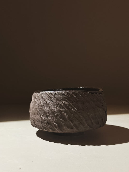 Kuro Matcha Bowl #08 with textured dark brown finish and glossy interior, inspired by volcanic stone.