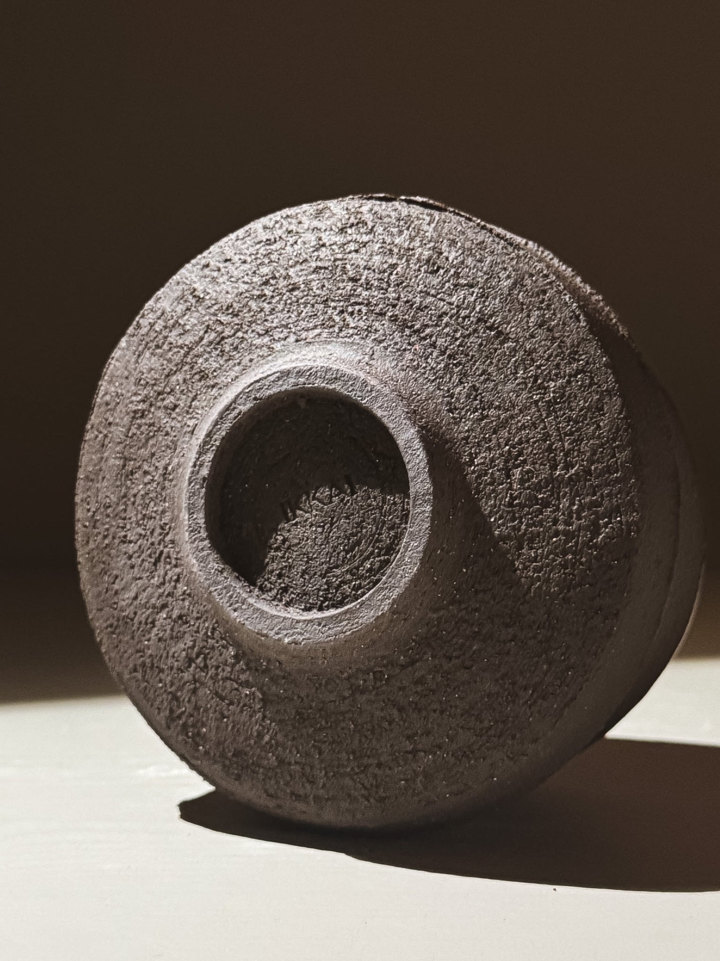 Kuro Matcha Bowl #09 with a textured dark brown surface showcasing volcanic stone inspiration.