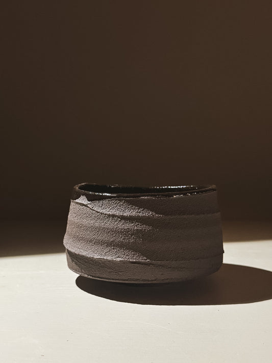 Kuro Matcha Bowl #10 with textured dark brown slip exterior and glossy dark glaze interior.