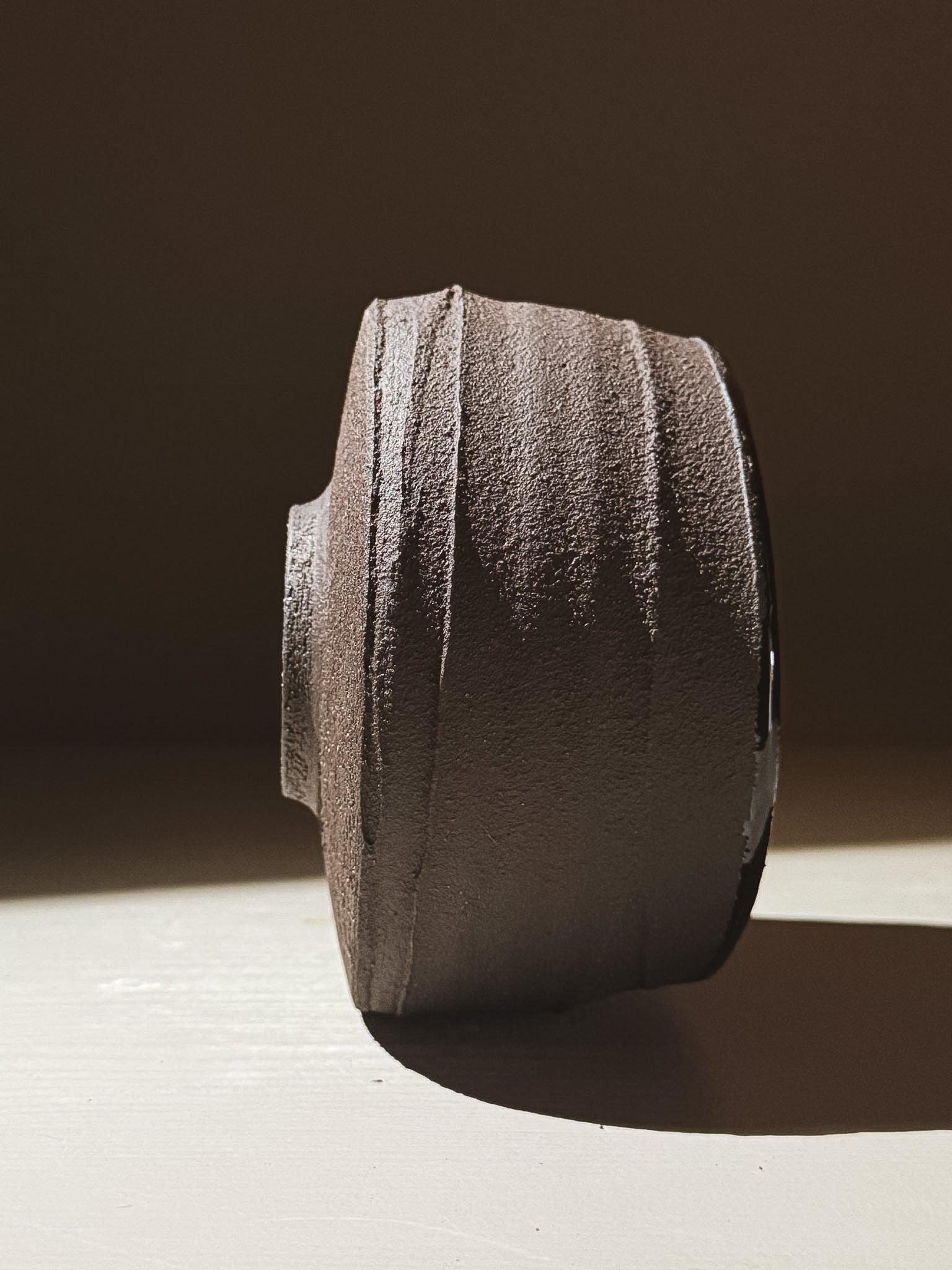 Kuro Matcha Bowl #10 showcasing earthy textures and dark tones with a heavily textured exterior.