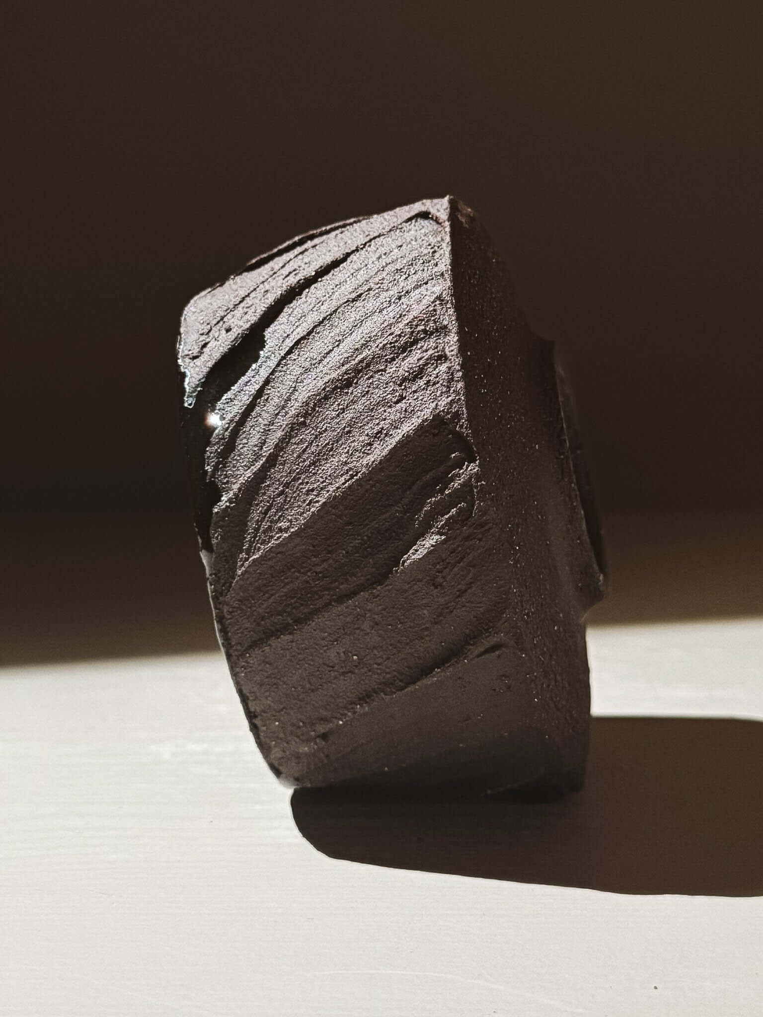 Yunomi Cup - Kuro #02 showcasing its textured dark brown clay and unique earthy design.