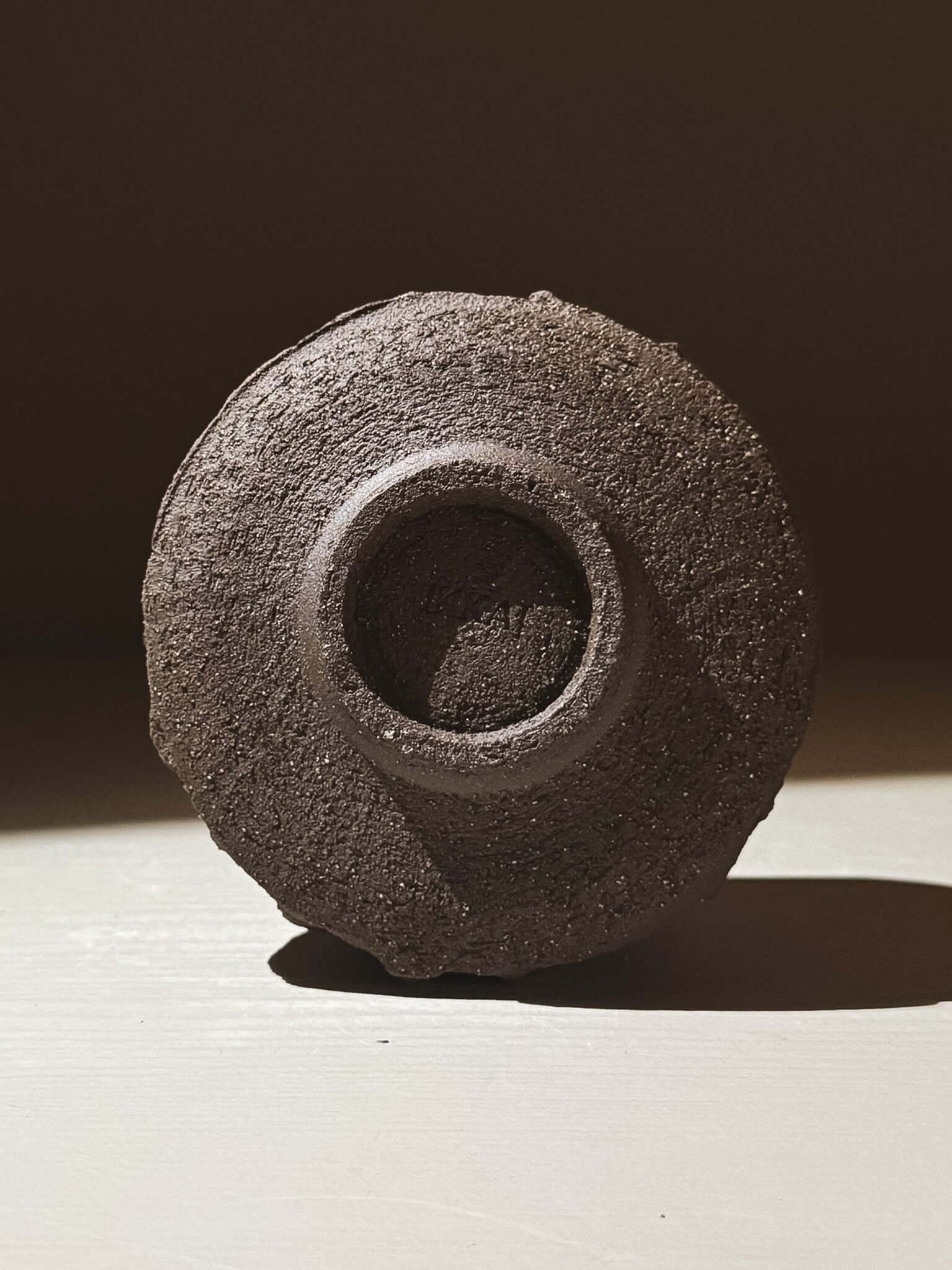 Yunomi Cup - Kuro #02 with a textured dark brown exterior, inspired by volcanic stone.