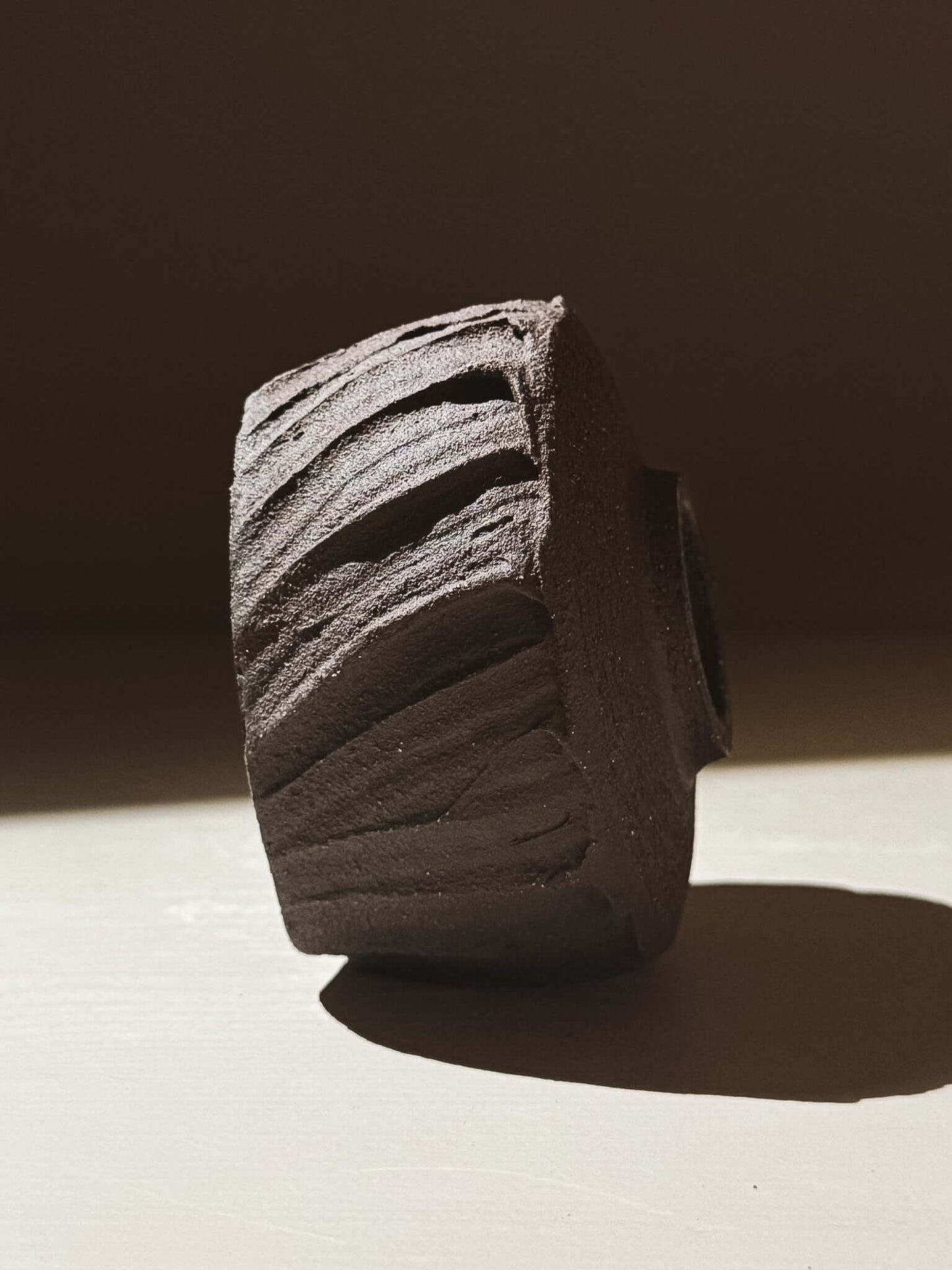 Yunomi Cup - Kuro #03 featuring textured dark brown clay resembling volcanic stone.