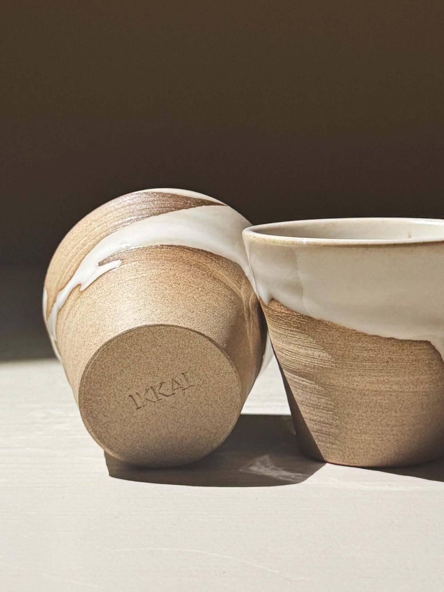 Espresso Cup - Yuki #01 showcasing its glossy white glaze and unique tapered shape.