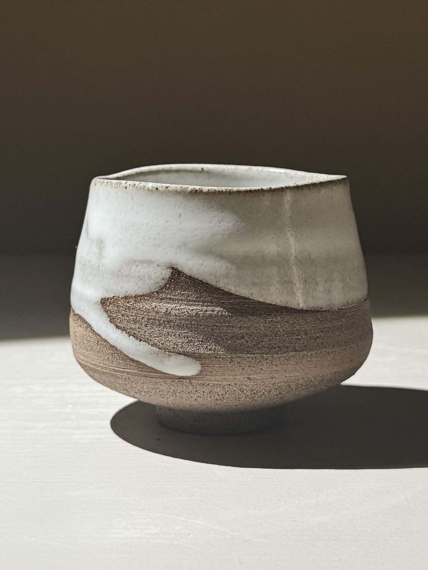 Yunomi Cup - Yuki Ash #01 featuring a soft glossy white glaze and warm textured clay body.