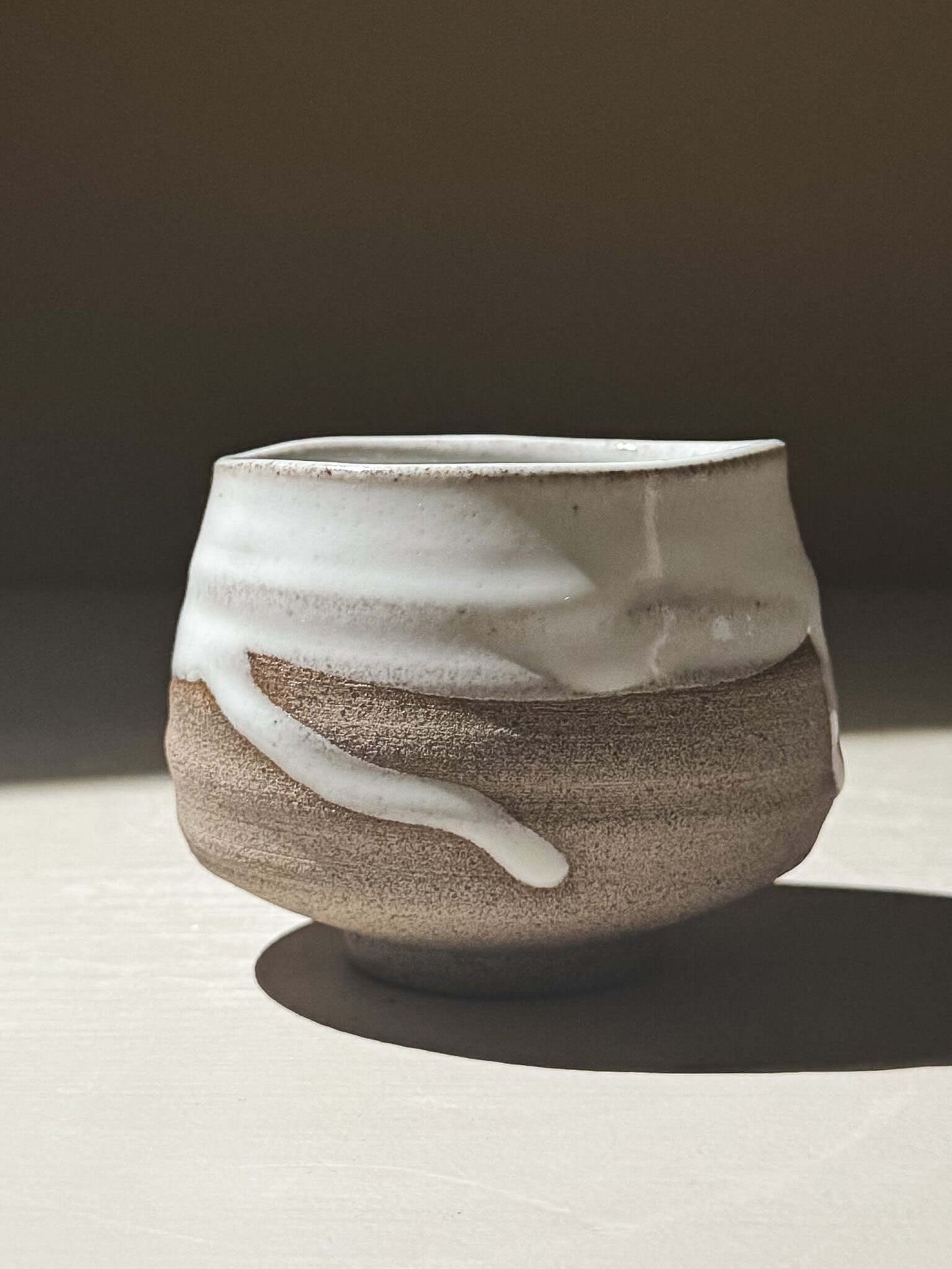 Yunomi Cup - Yuki Ash #02 showcasing a glossy white glaze on textured ash-grey stoneware.