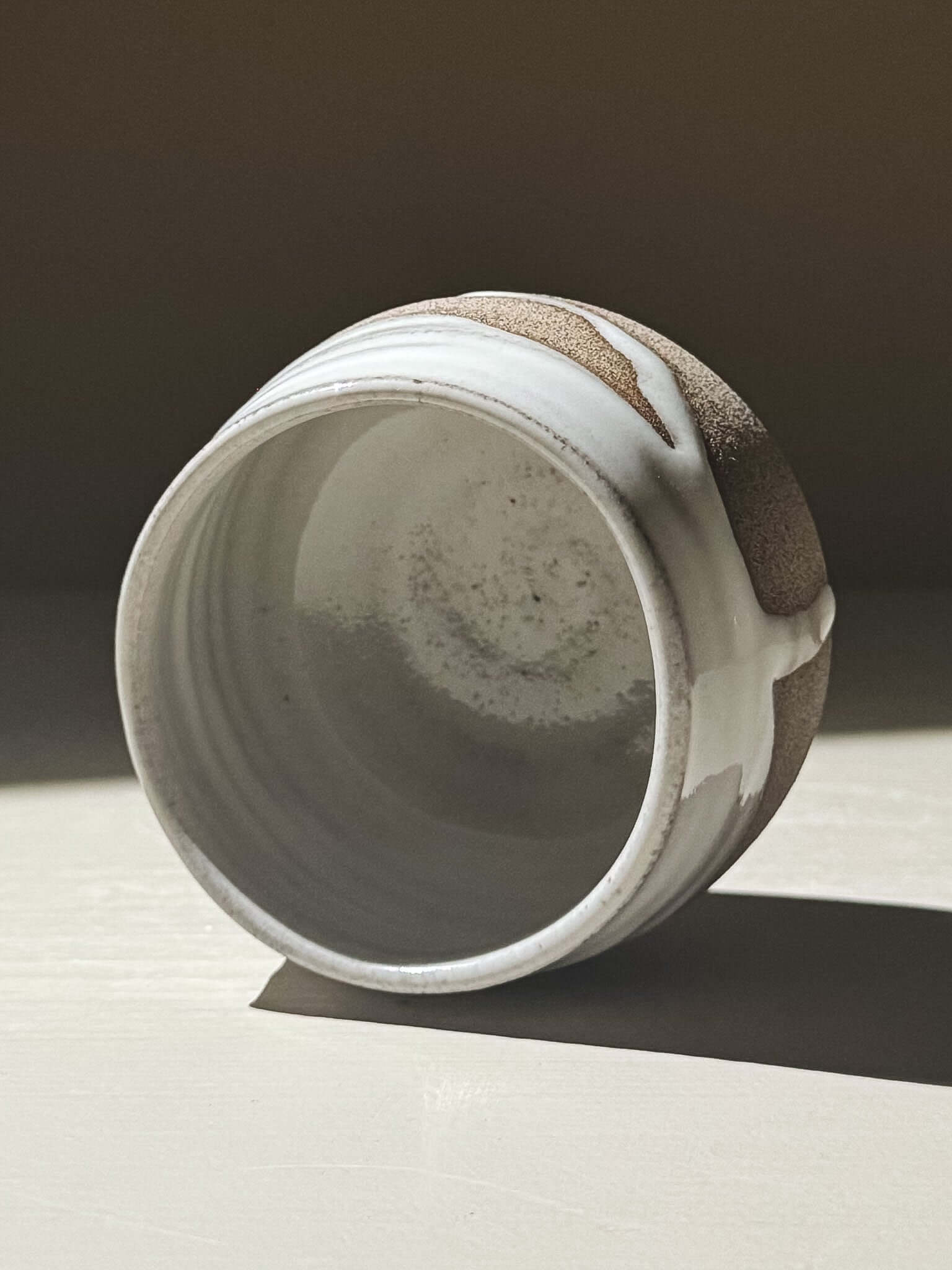 Yunomi Cup - Yuki Ash #02 with ash-grey stoneware and glossy white glaze, showcasing unique texture details.
