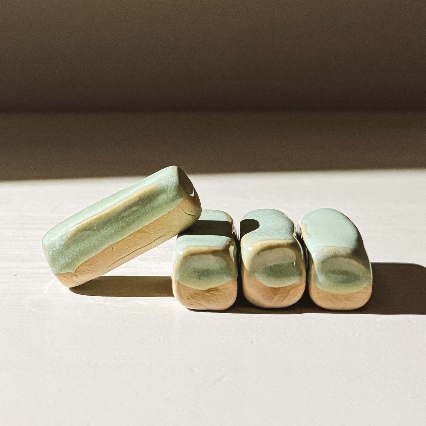 Chopstick/Spoon Rest – Sage handmade with glossy glaze and rounded edges, set of sage-colored holders.