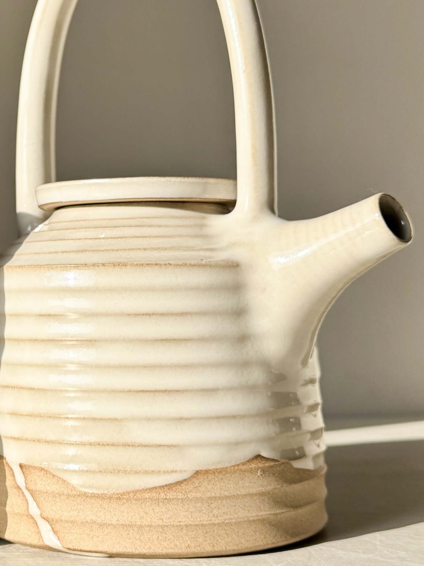 Handmade ceramic Teapot - Yuki Series #01 with tall looped handle and white glaze.
