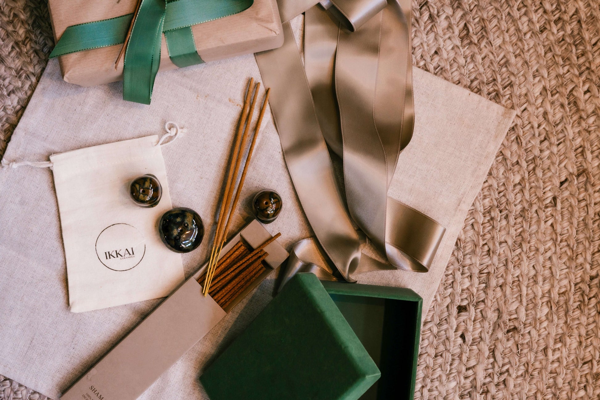 Handmade ceramic Incense Holder Pebbles with incense sticks and gift packaging, featuring a rustic and organic aesthetic for home décor.