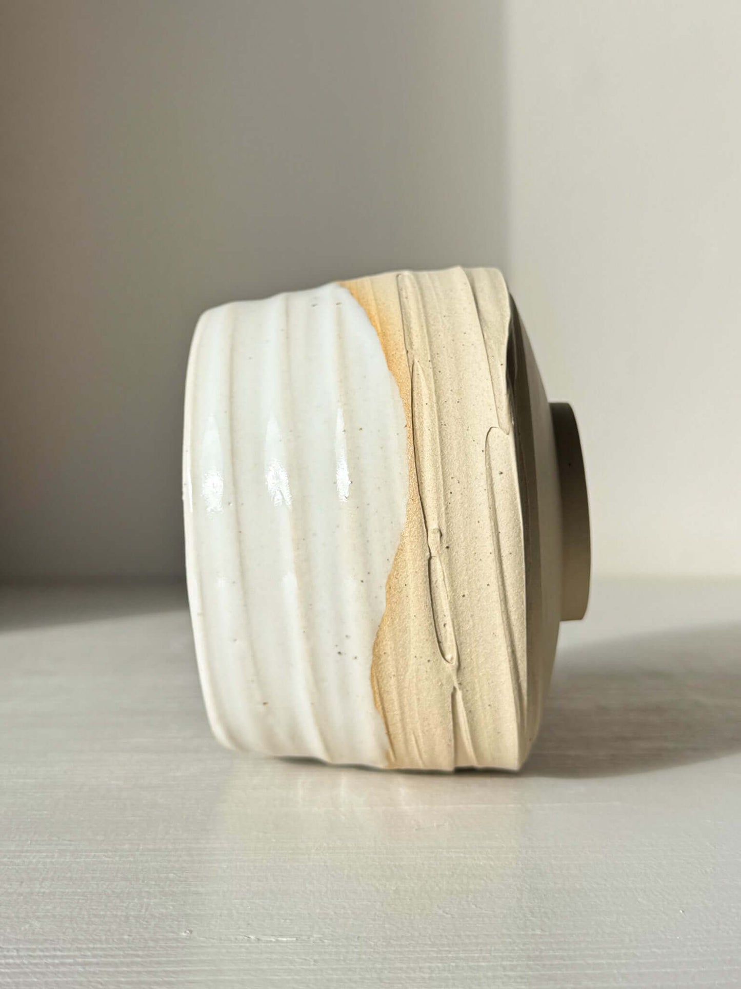 Handmade ceramic Matcha Bowl – Half Glossy White Glaze #01 with speckled stoneware and natural glaze drip details.