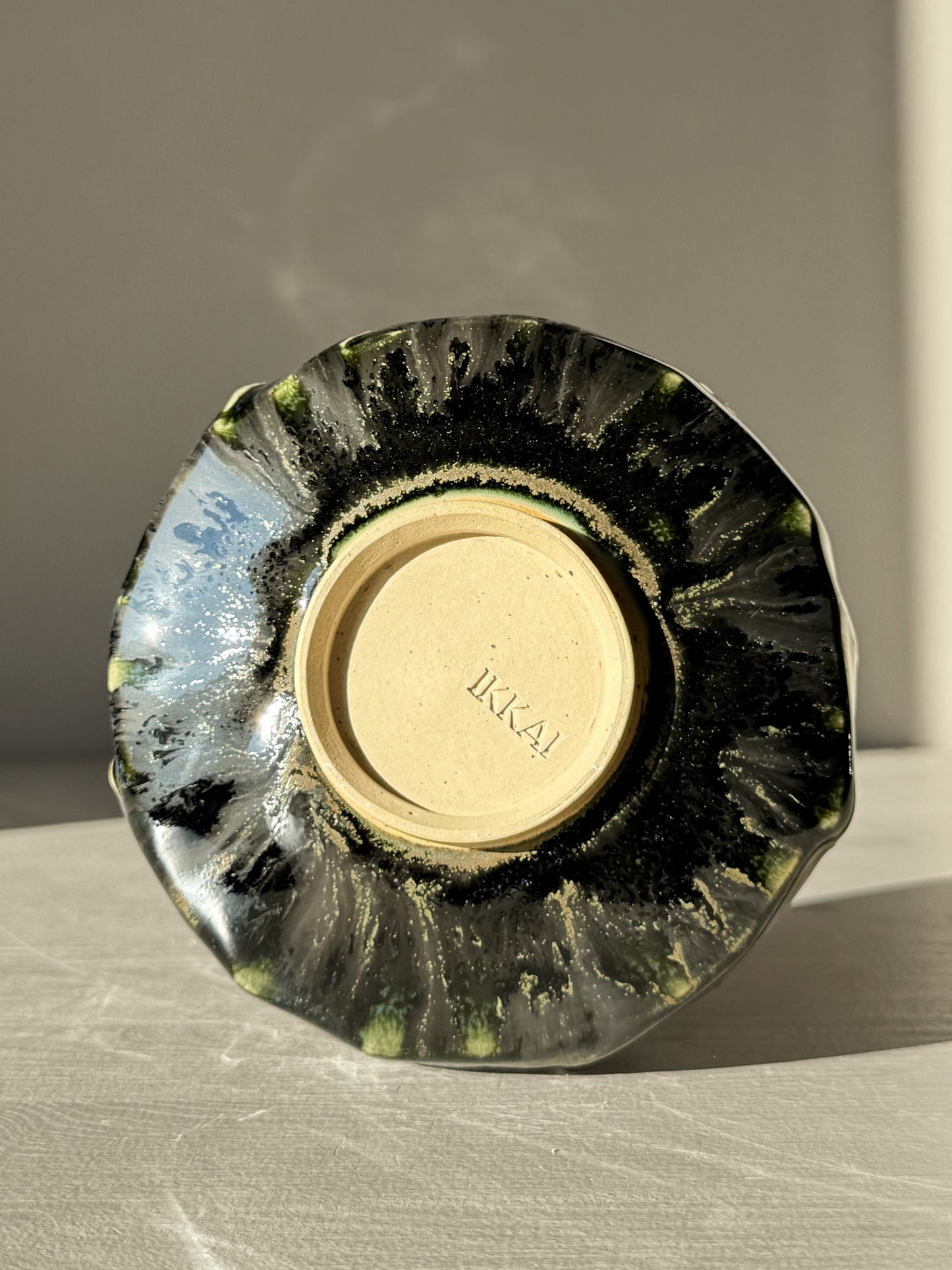 Textured Matcha Bowl - Hinoki #13 with unique green and black glaze displayed on its side