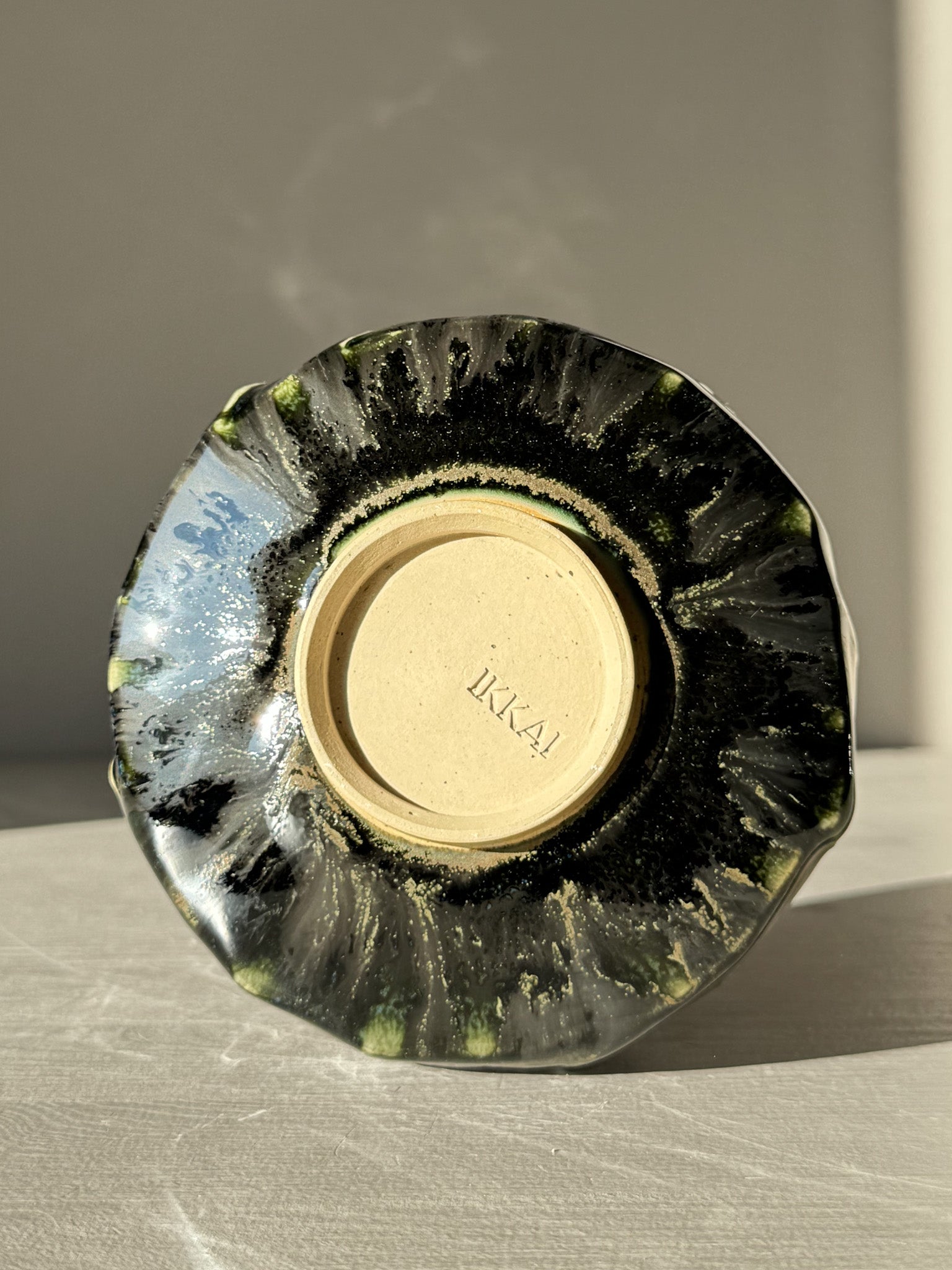 Textured Matcha Bowl - Hinoki #13 with unique green and black glaze displayed on its side