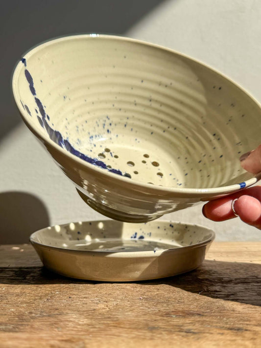 Small Berry Bowl from Gosu Series with cobalt blue splashes, designed for rinsing fruit and serving, on matching drip plate.