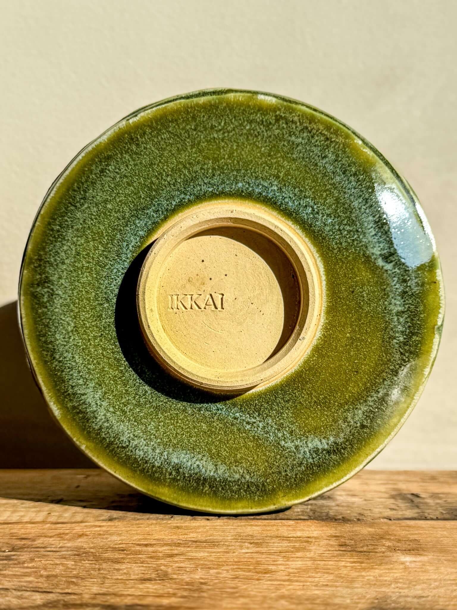 Wasabi Green Matcha Bowl with textured glaze and carved design, showcasing natural earthy tones and organic lines.