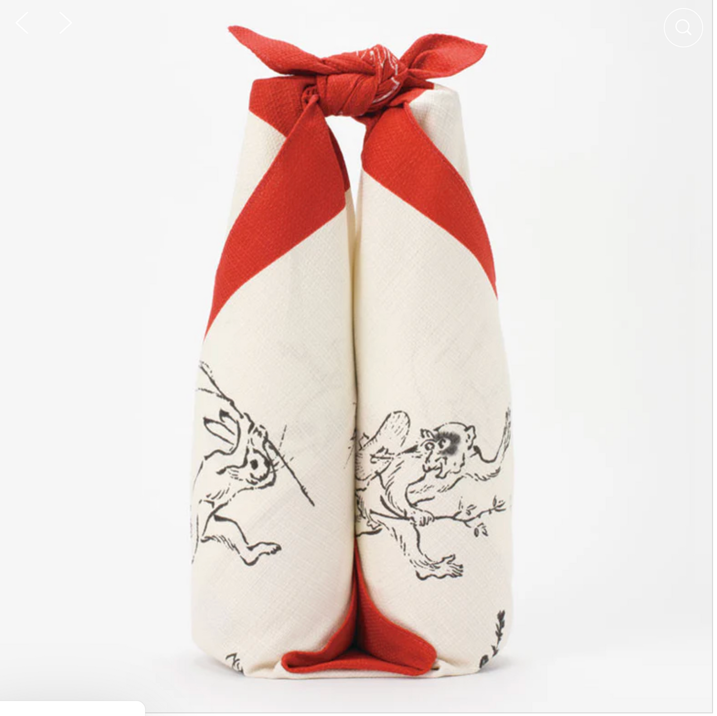 Medium furoshiki wrapped around two bottles in red and cream organic cotton cloth with animal illustrations inspired by Choju Jinbutsu Giga.