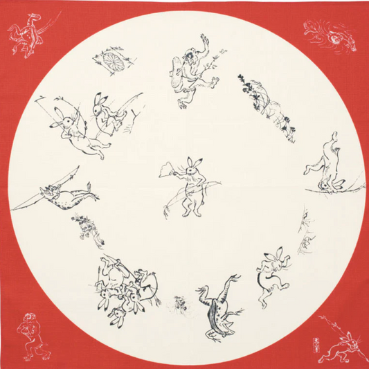 Japanese Medium furoshiki with rabbits, frogs, and monkeys in a round window design on red organic cotton cloth.