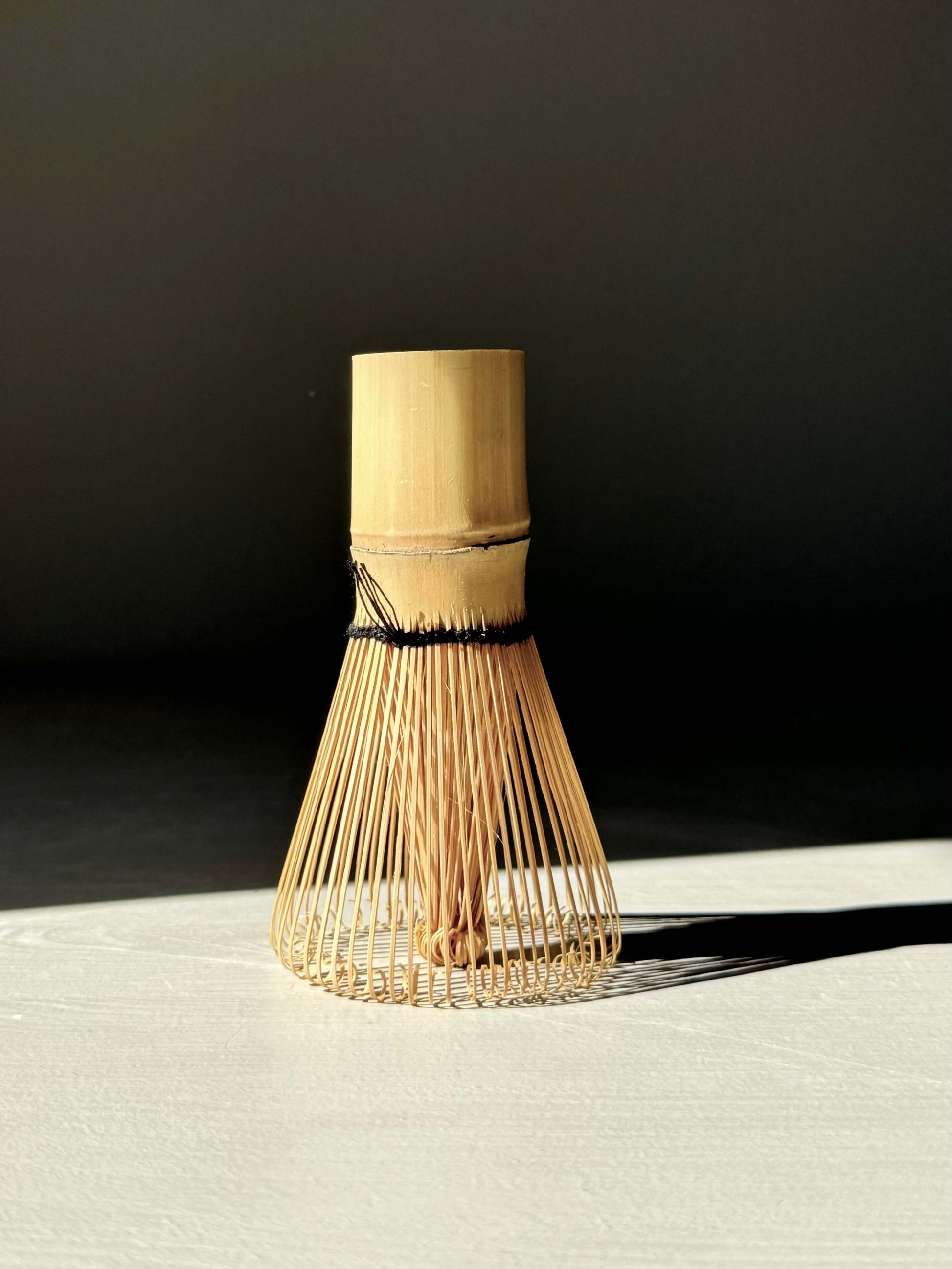 Bamboo Matcha Whisk (Chasen) for blending vibrant green tea, crafted from a single piece of bamboo with delicate curved tines.