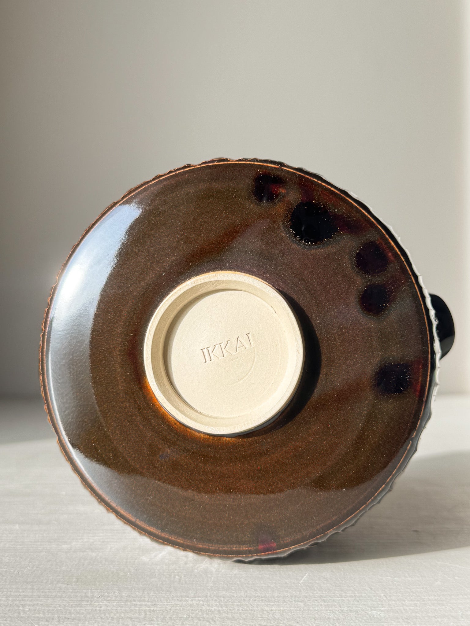 Bottom view of Matcha Bowl Spout – Kinsei #02 showing handcrafted glaze and IKAI imprint.