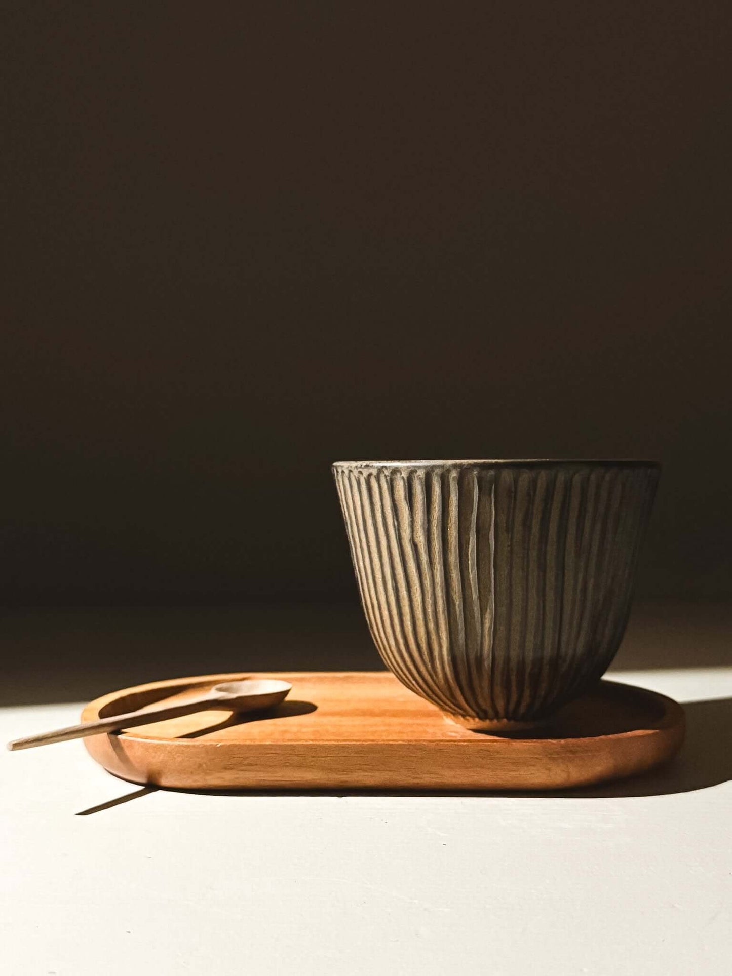Carved Yunomi Cup - Black Truffle on wooden tray, handmade ceramics pottery