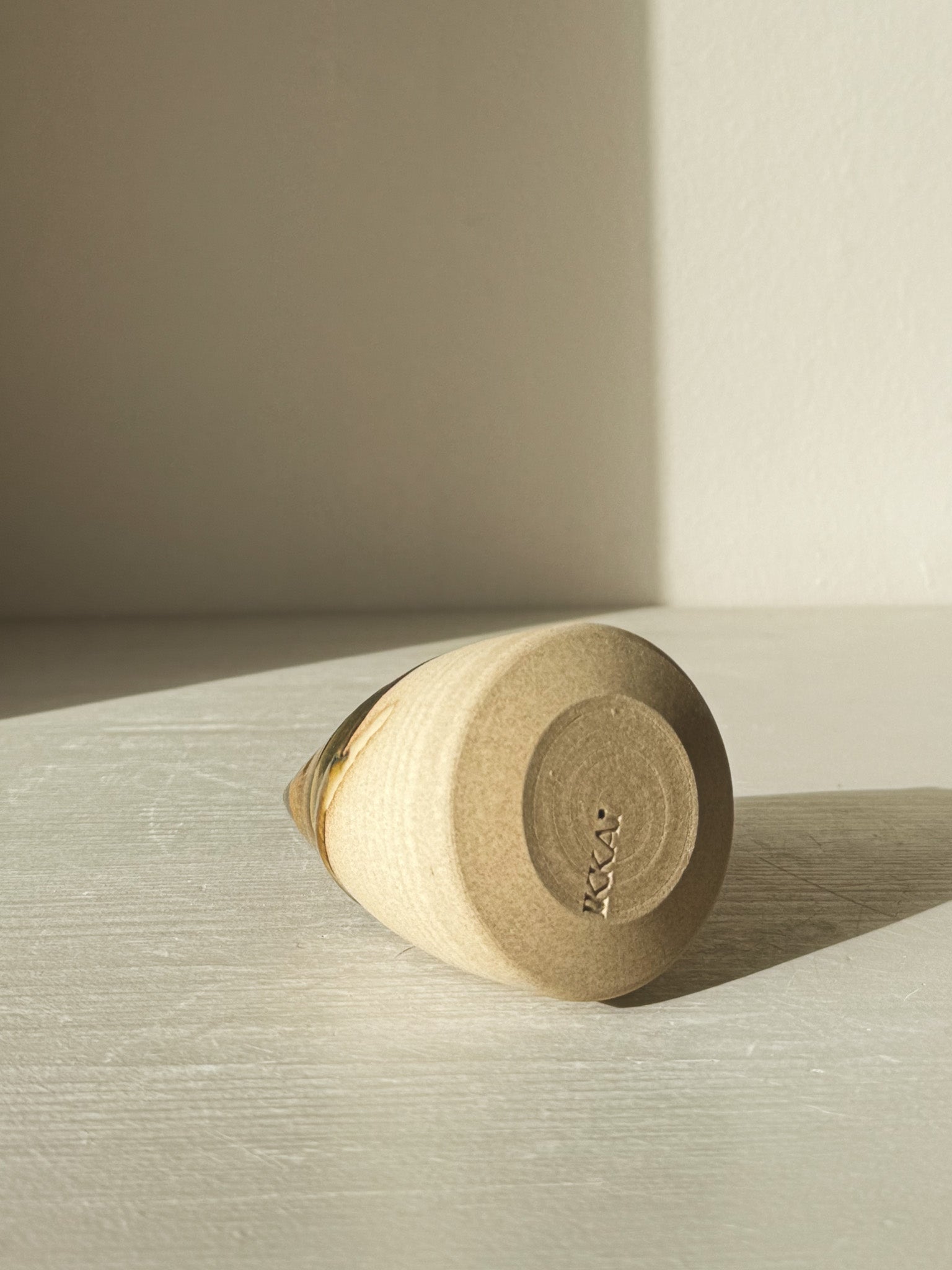 Base of Ceramic Christmas Tree – Inyo #02 with natural light highlighting texture and Tenmoku glaze finish.