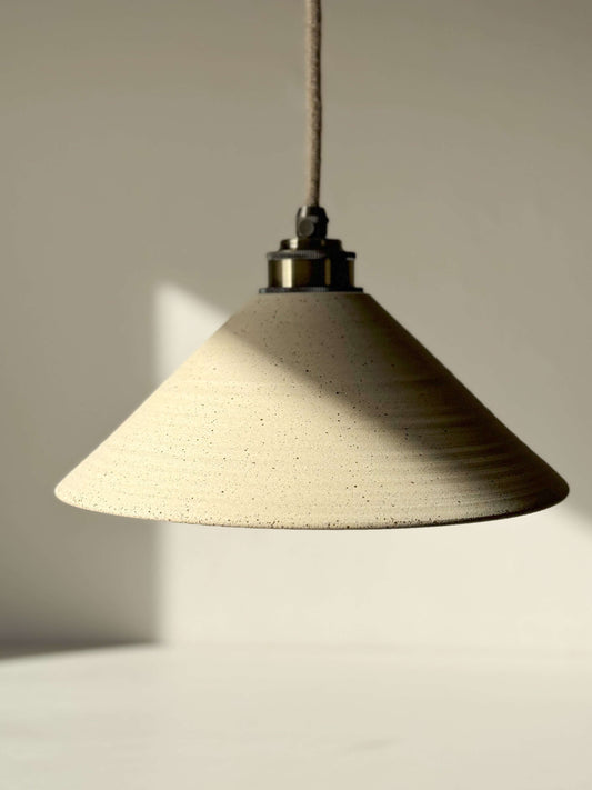 Rustic ceramic lamp shade with half clear glaze, featuring natural matte clay exterior and smooth glazed interior for a cozy ambiance.