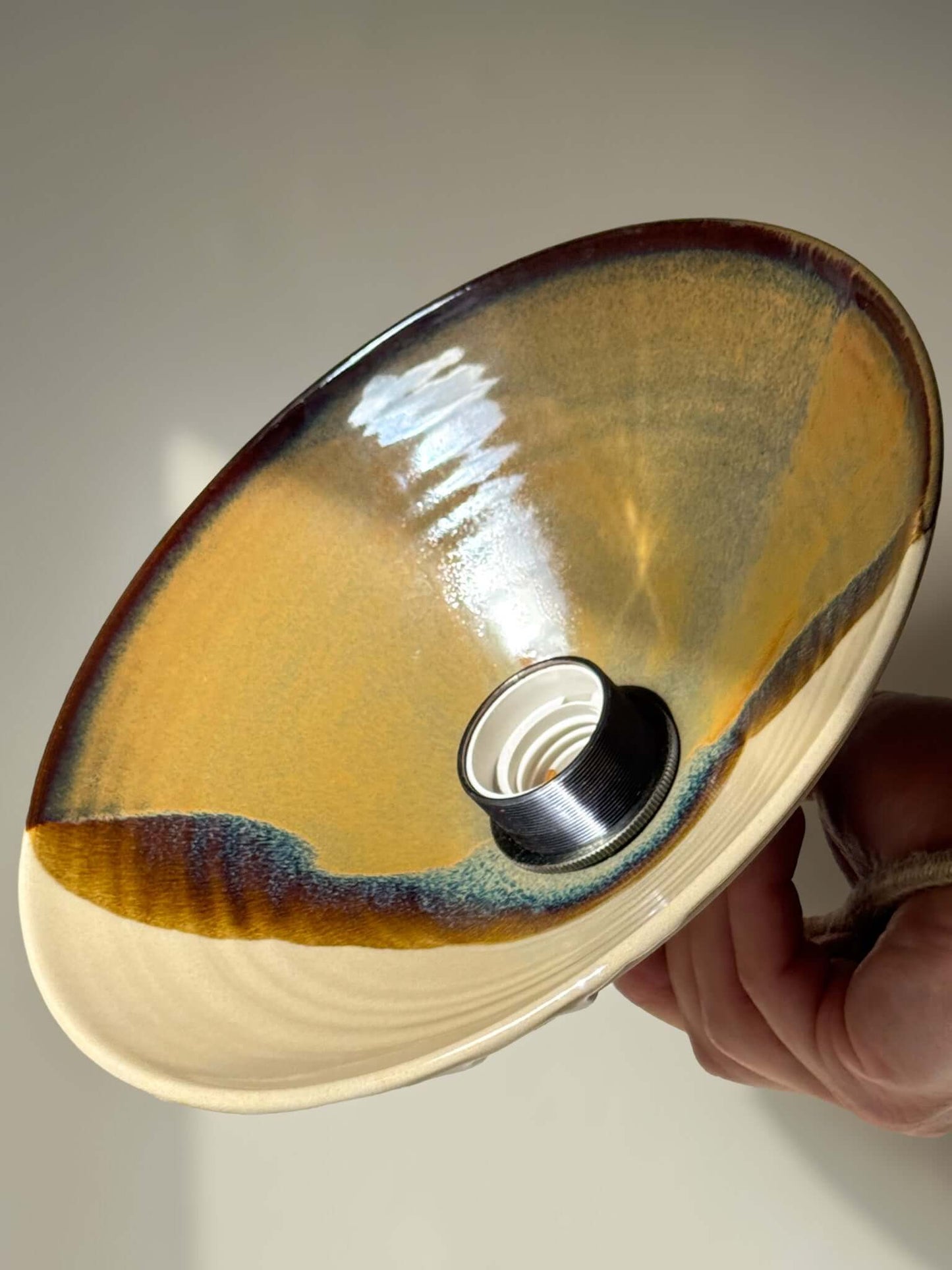 Handmade Ceramic Lamp Shade – Inyo #02 with bronze, amber, and blue glaze, showing soft surface and natural glaze drips.